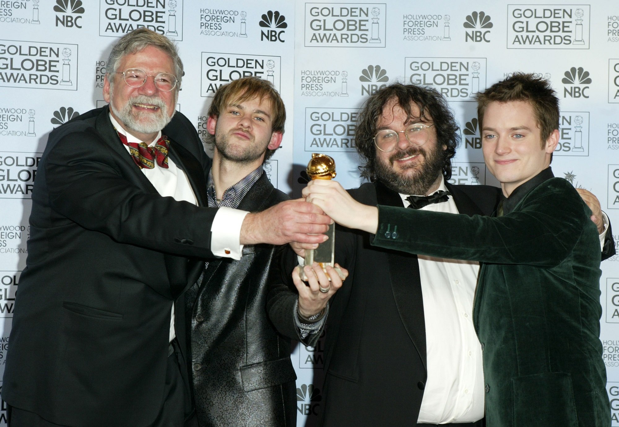 Barrie M. Osbourne, Dominic Monaghan, Peter Jackson, and Elijah Wood, of Lord of the Rings 