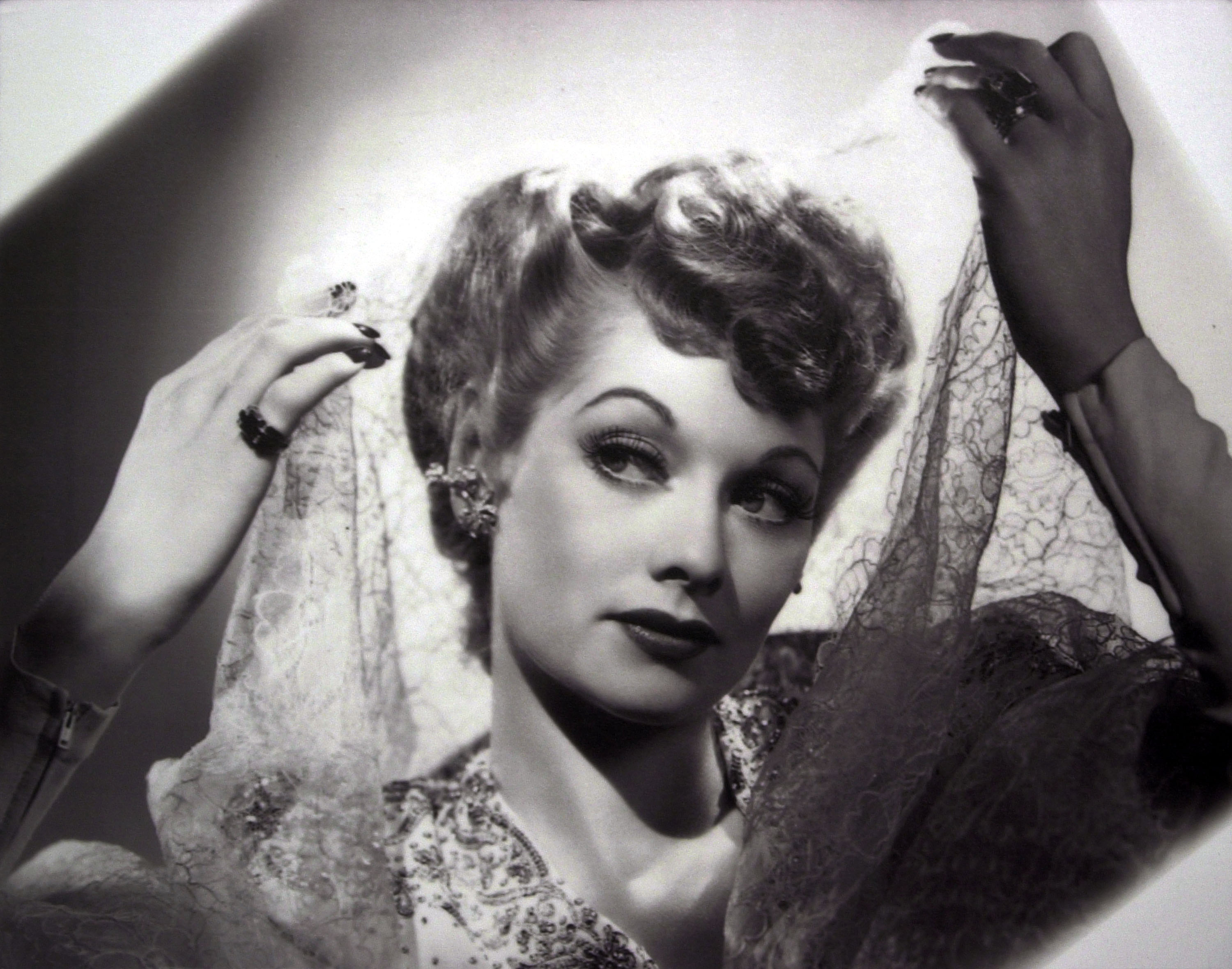 Lucile Ball holding a cloth