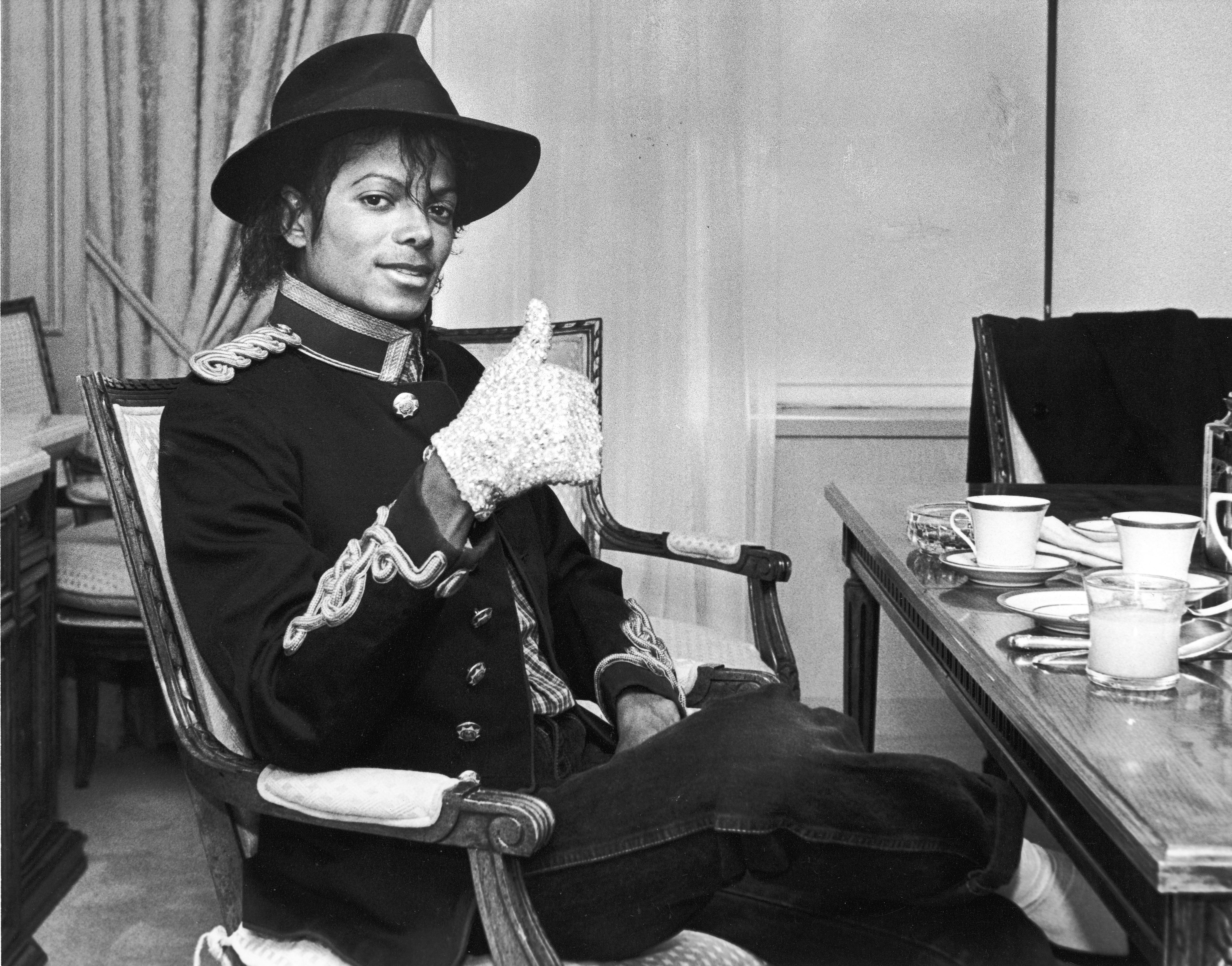 Michael Jackson wearing a glove and a hat