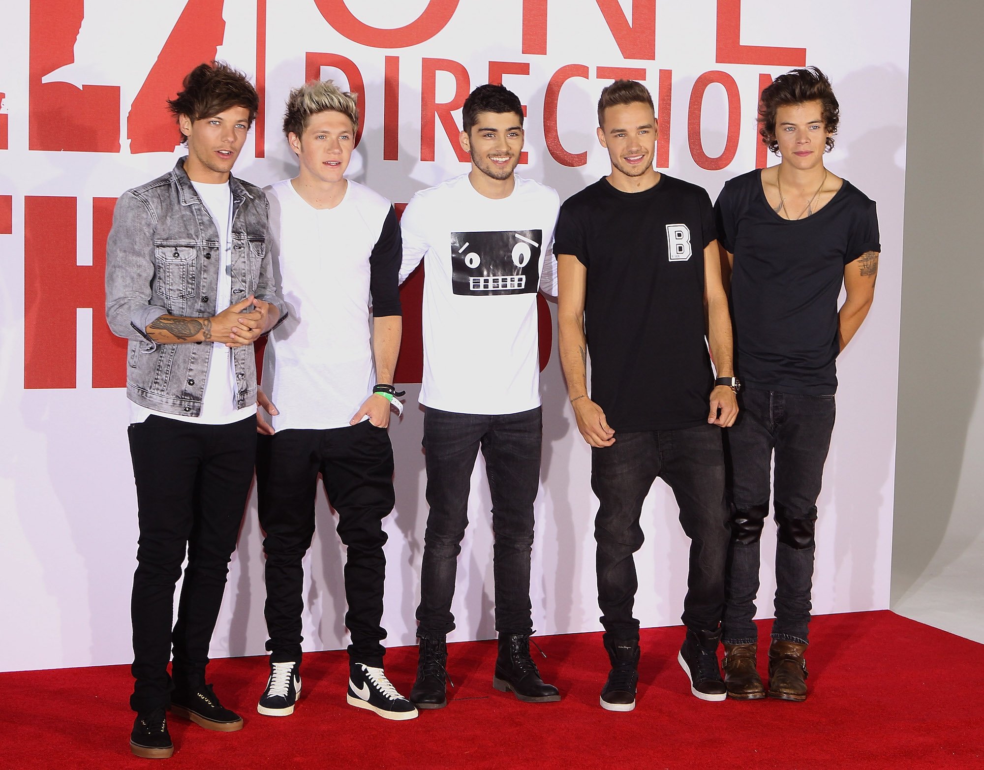 Louis Tomlinson, Niall Horan, Zayn Malik, Liam Payne, and Harry Styles of One Direction at a Photocall for their film 'This is Us' on Aug. 19, 2013