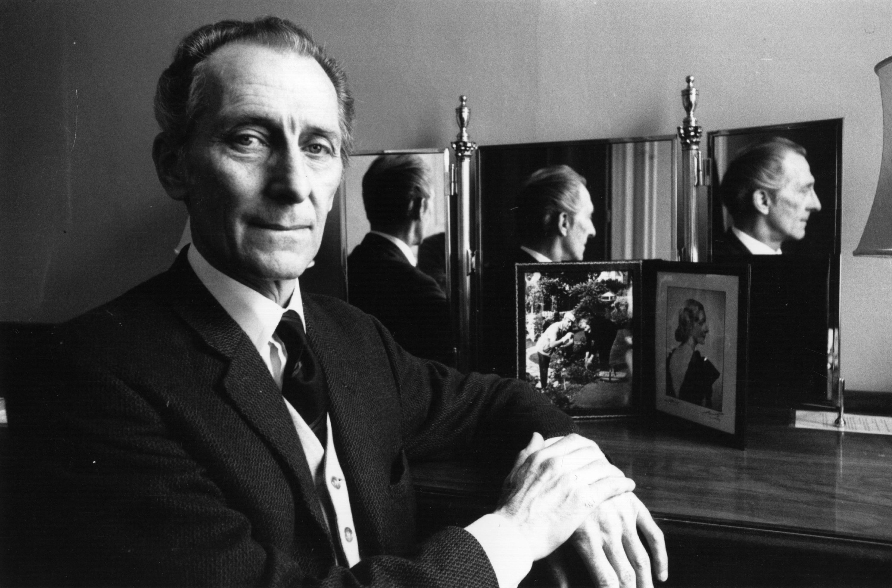 Peter Cushing near a mirror