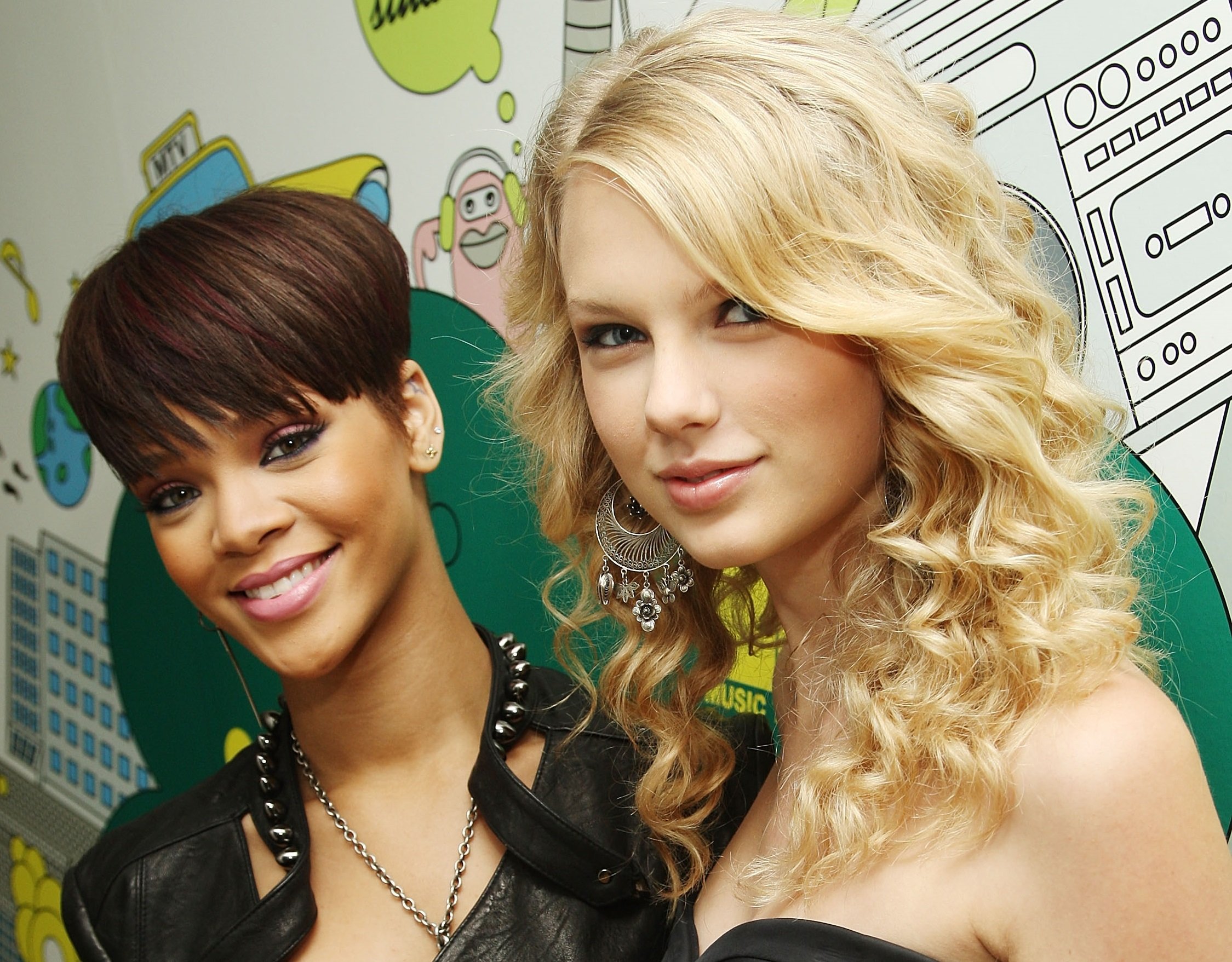 Rihanna (L) and Taylor Swift visit MTV's TRL at MTV Studios on June 17, 2008 in New York City.