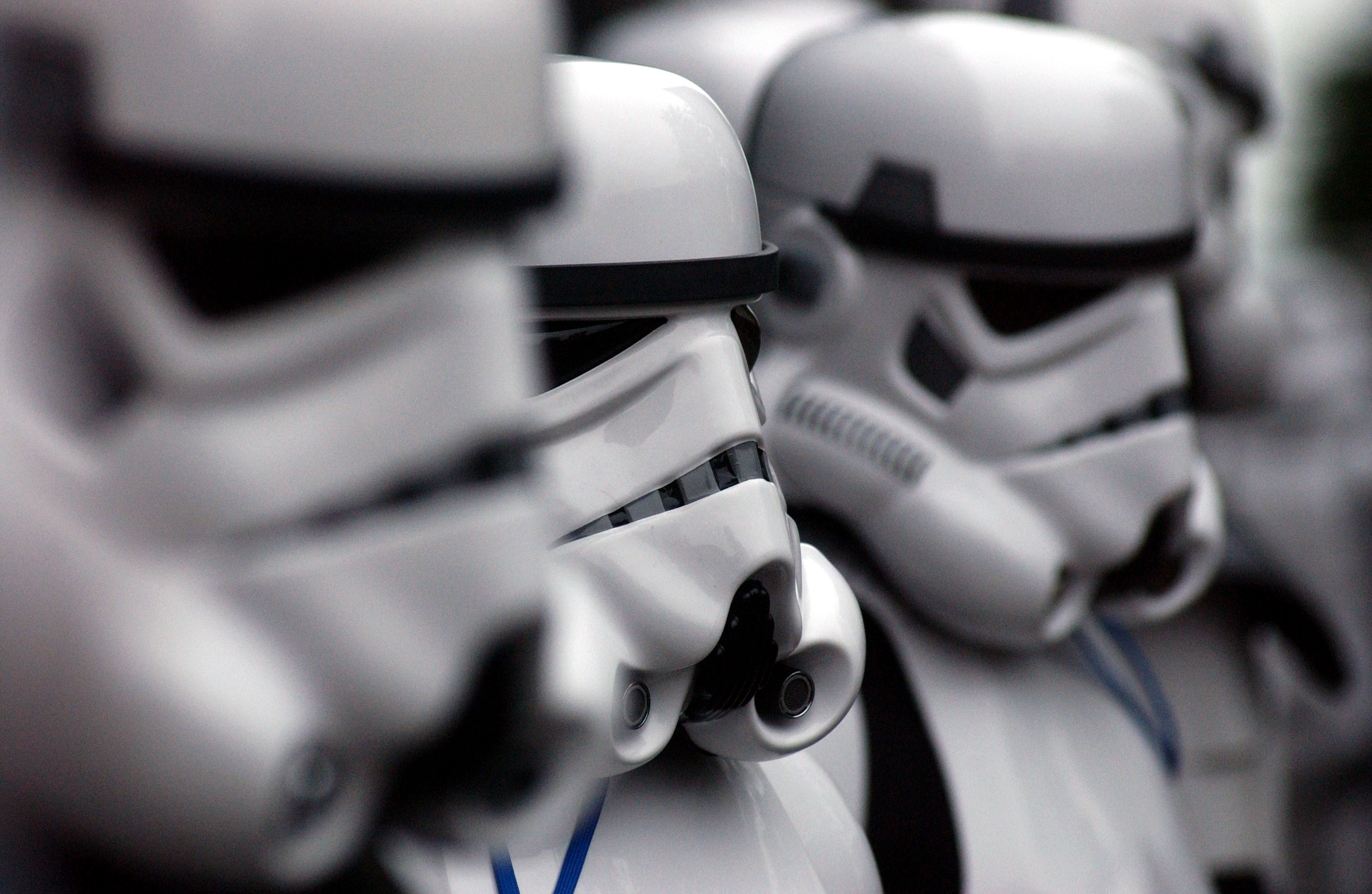 A number of Stormtroopers standing next to each other