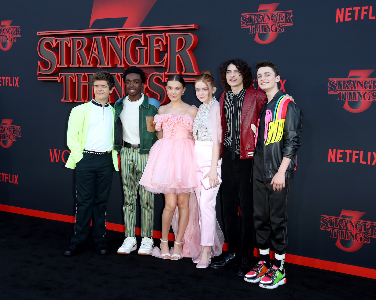 Gaten Matarazzo, Caleb McLaughlin, Millie Bobby Brown, Sadie Sink, Finn Wolfhard, and Noah Schnapp attend the premiere of Netflix's 'Stranger Things'