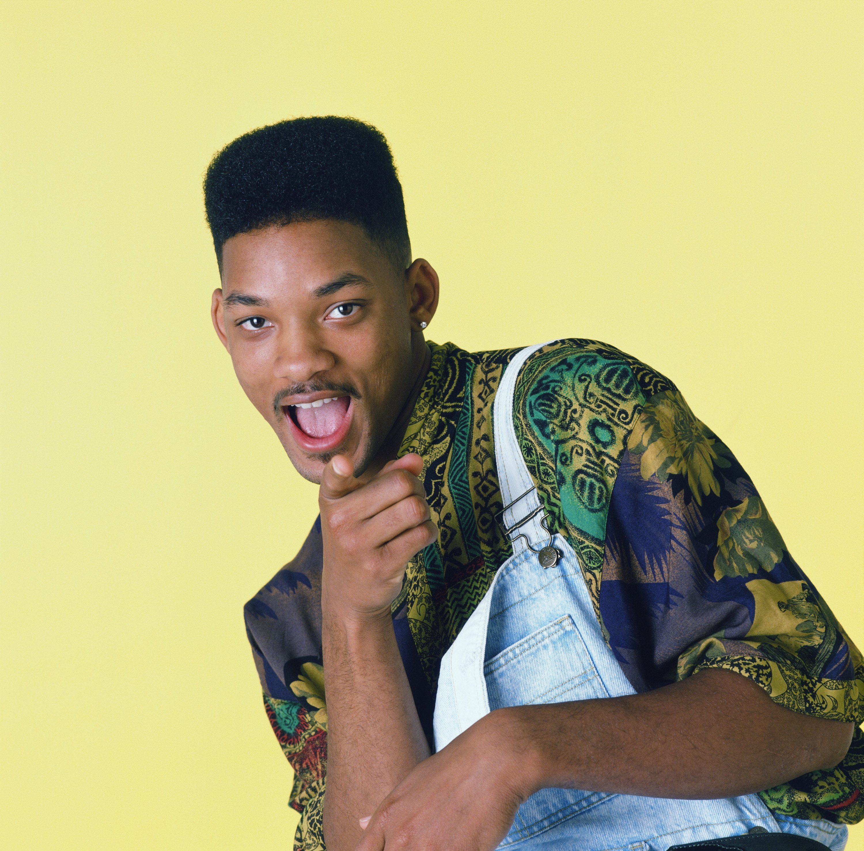 Will Smith in front of a yellow background