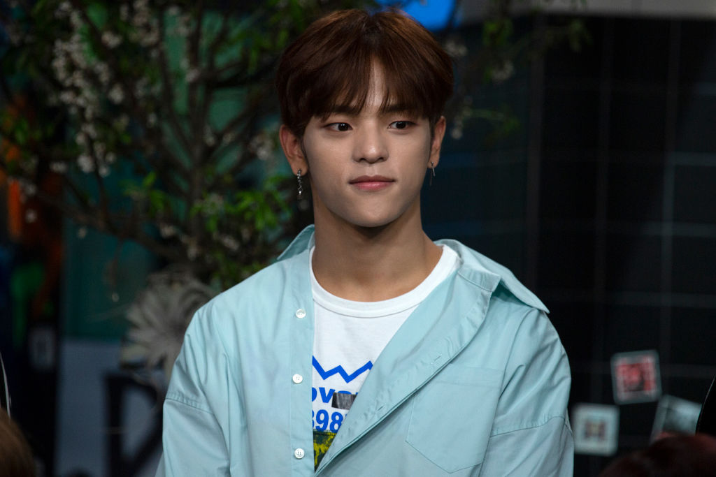 Woojin in a blue shirt
