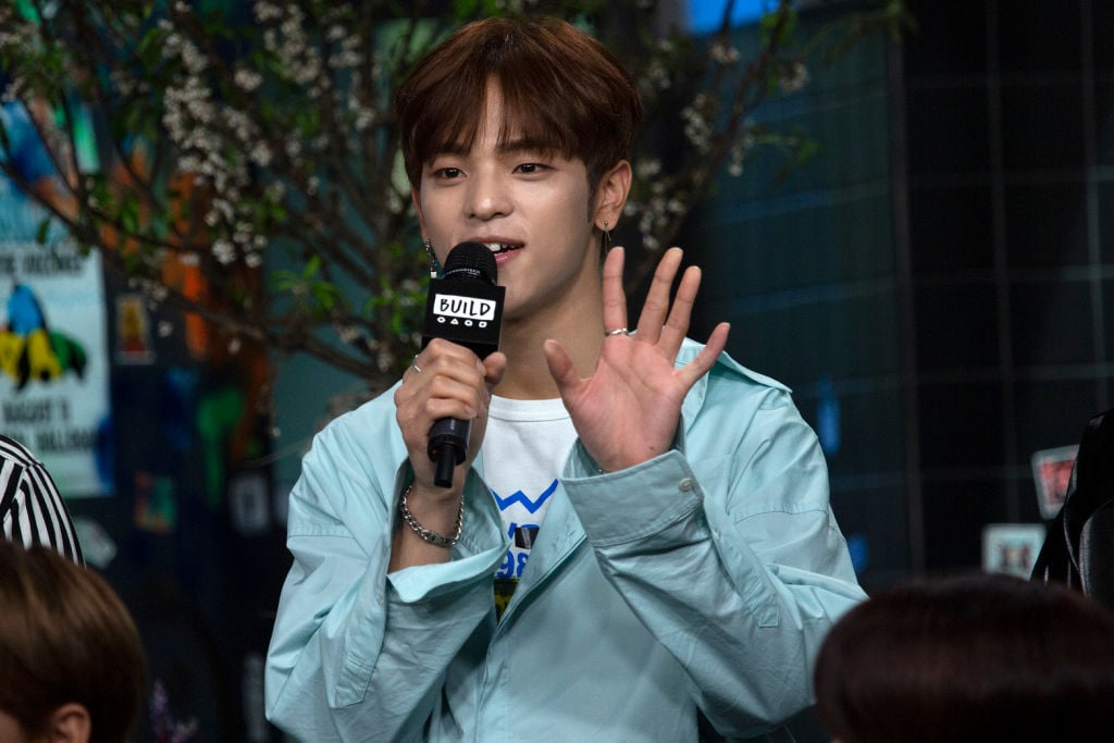 Woojin holding a microphone