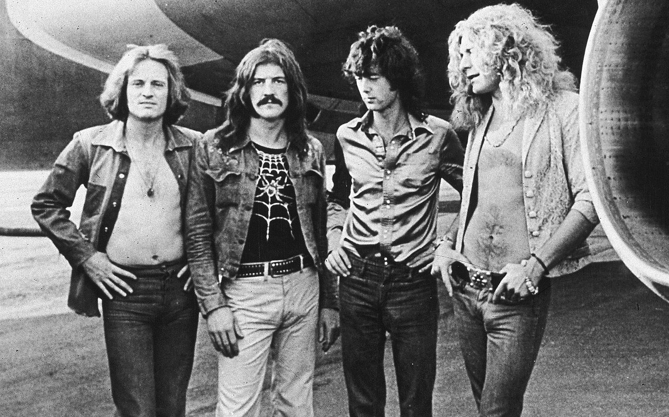 Led Zeppelin posed at the band jet