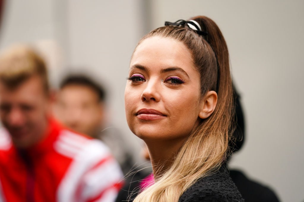 Ashley Benson smiling, turned to the side