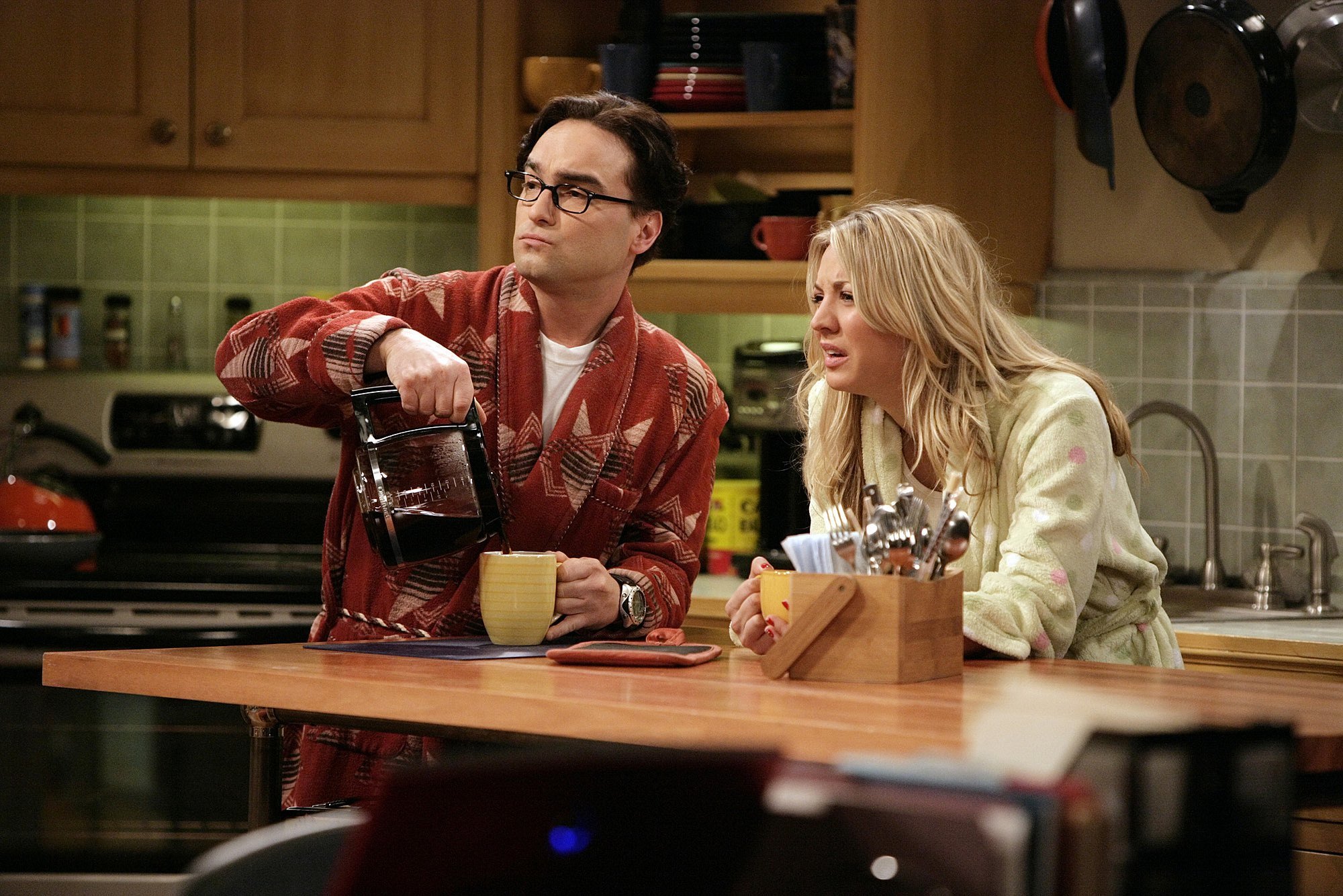 Leonard and Penny standing in the kitchen on 'The Big Bang Theory'