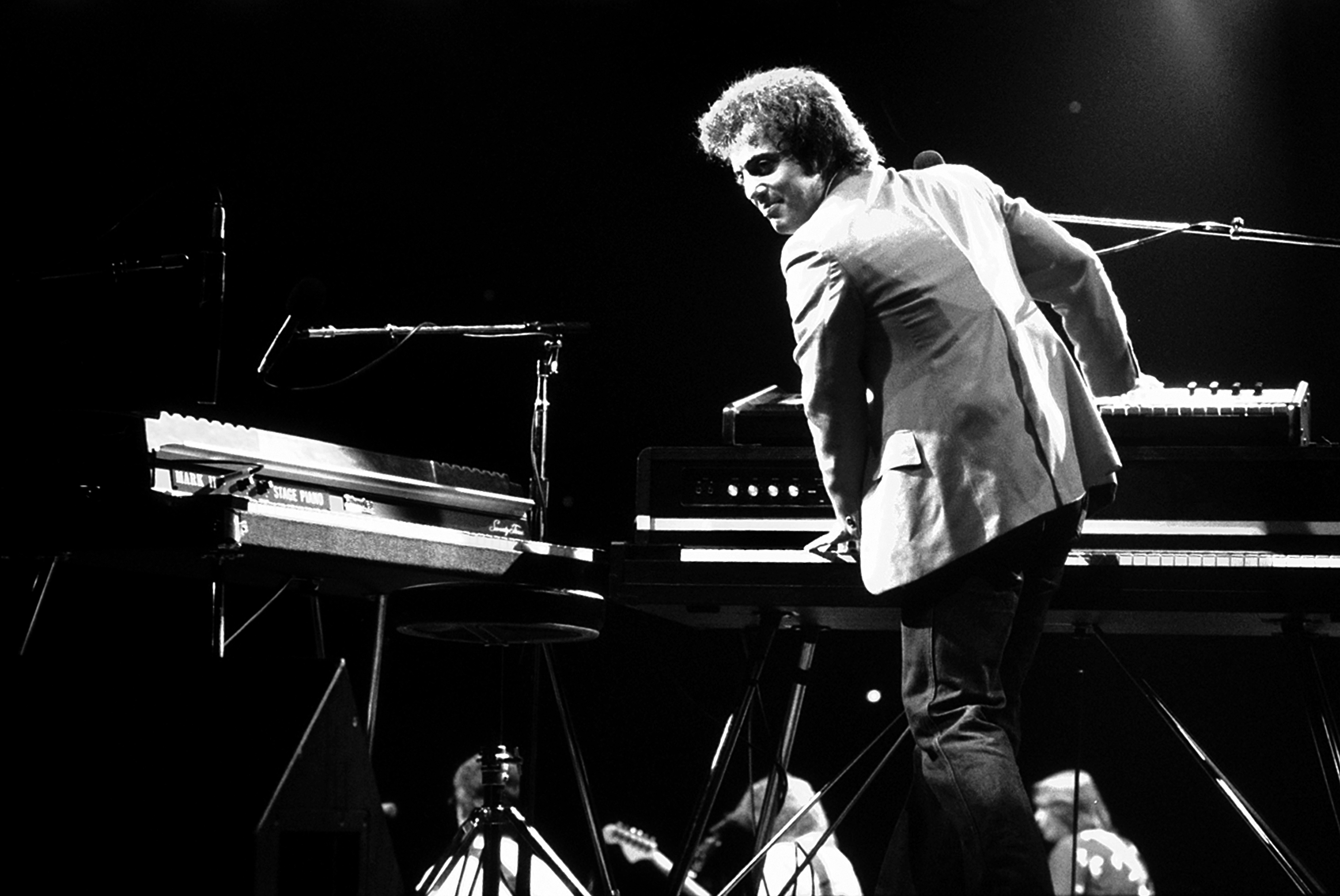 Billy Joel performs on stage in 1980