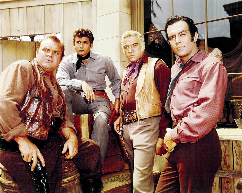 (L-R) Dan Blocker as Eric 'Hoss' Cartwright, Michael Landon as Joseph 'Little Joe' Cartwright, Lorne Greene as Ben Cartwright and Pernell Roberts as Adam Cartwright looking above the camera on 'Bonanza'