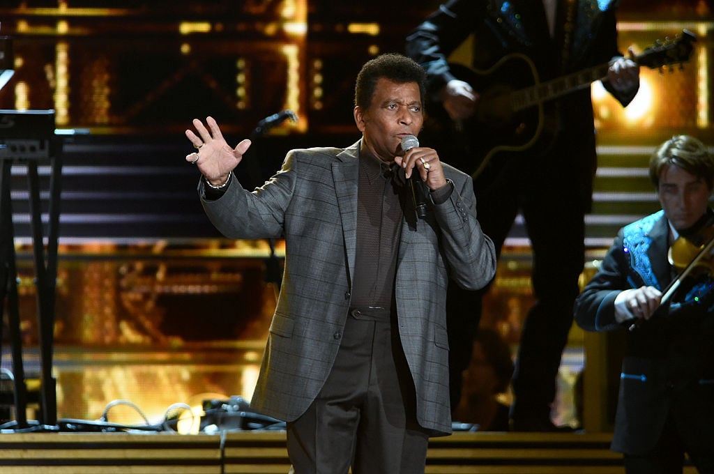 Charley Pride singing on stage