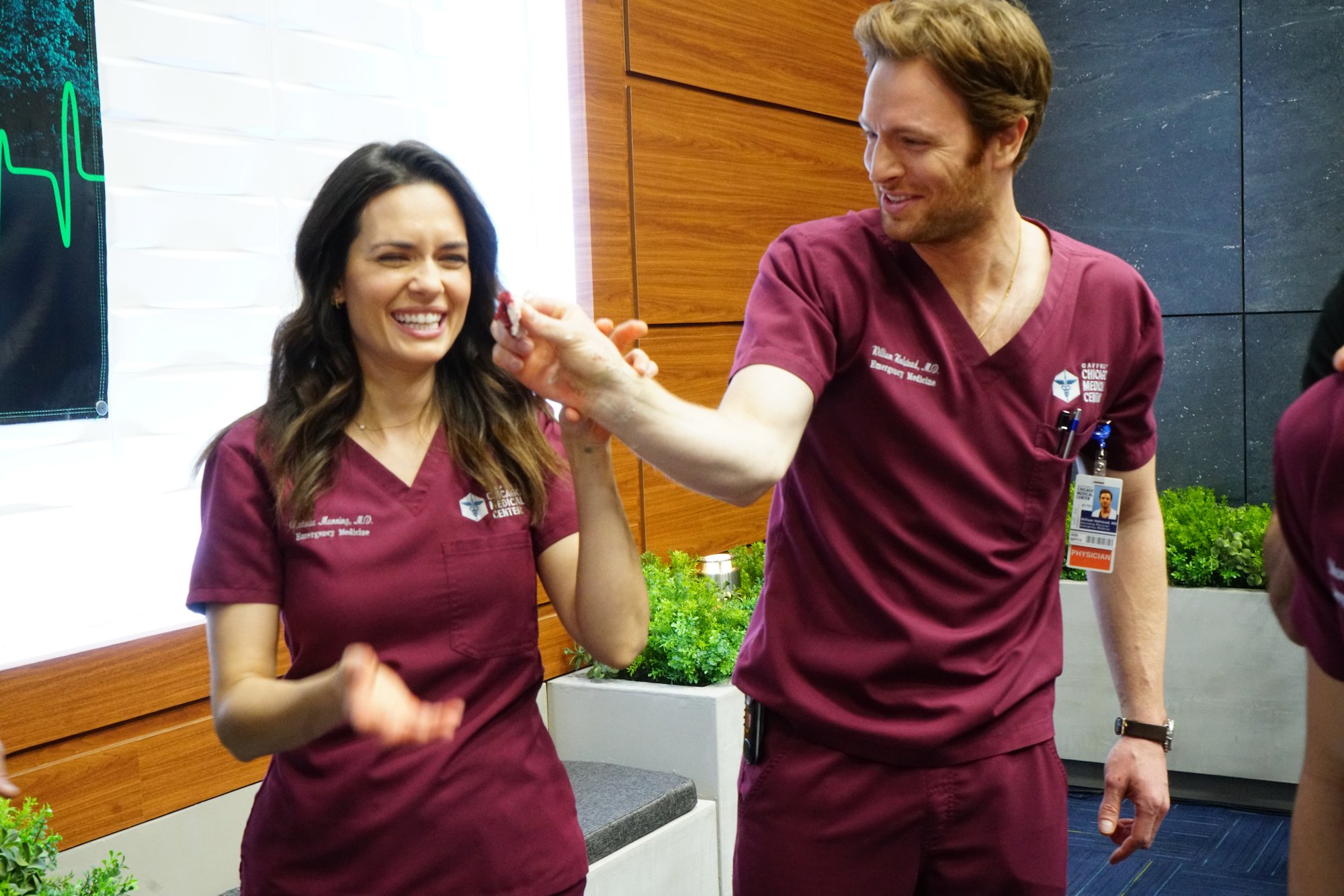 (L-R) Torrey Devitto and Nick Gehlfuss in costume on 'Chicago Med' laughing