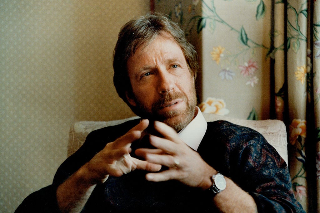 Chuck Norris, turned slightly to the right, gesturing while talking