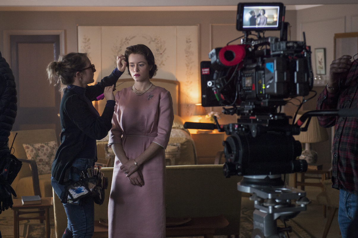 Claire Foy during a hair and makeup touch up on the set of 'The Crown' Season 2 Episode 1