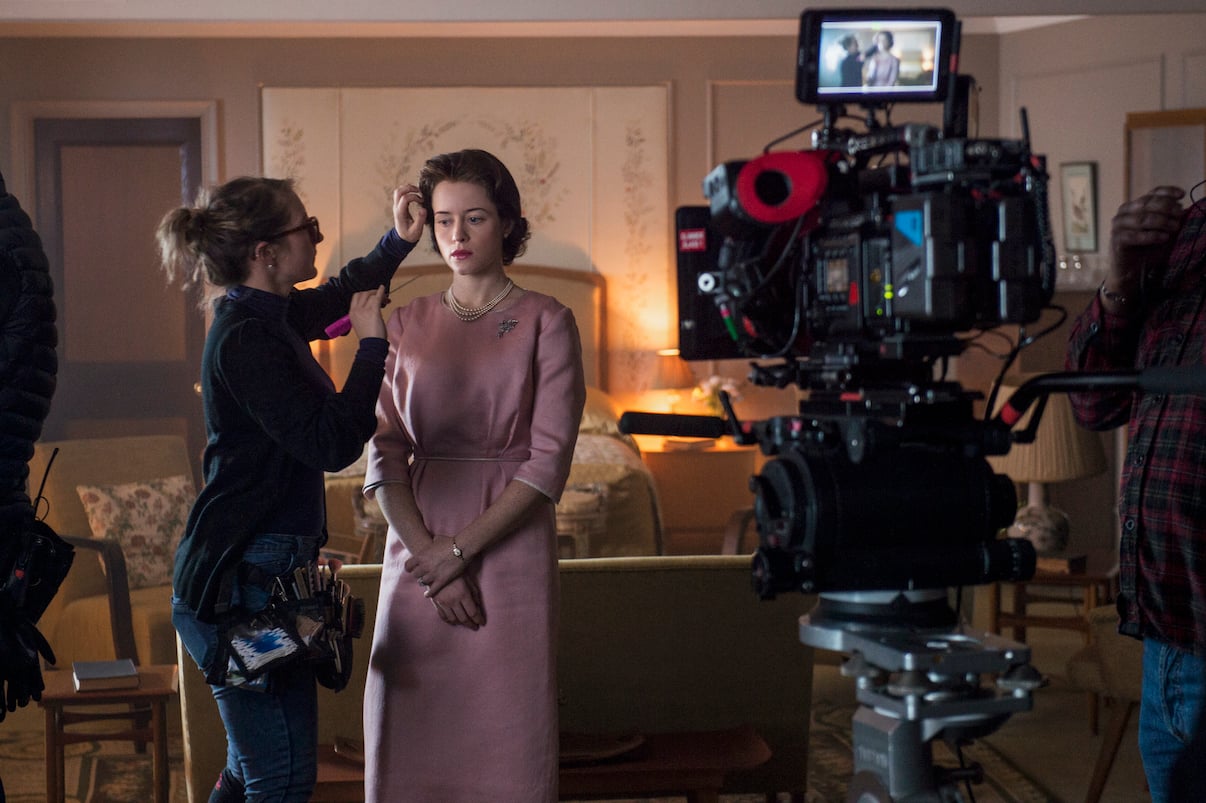 Claire Foy during a hair and makeup touch up on the set of 'The Crown' Season 2 Episode 1