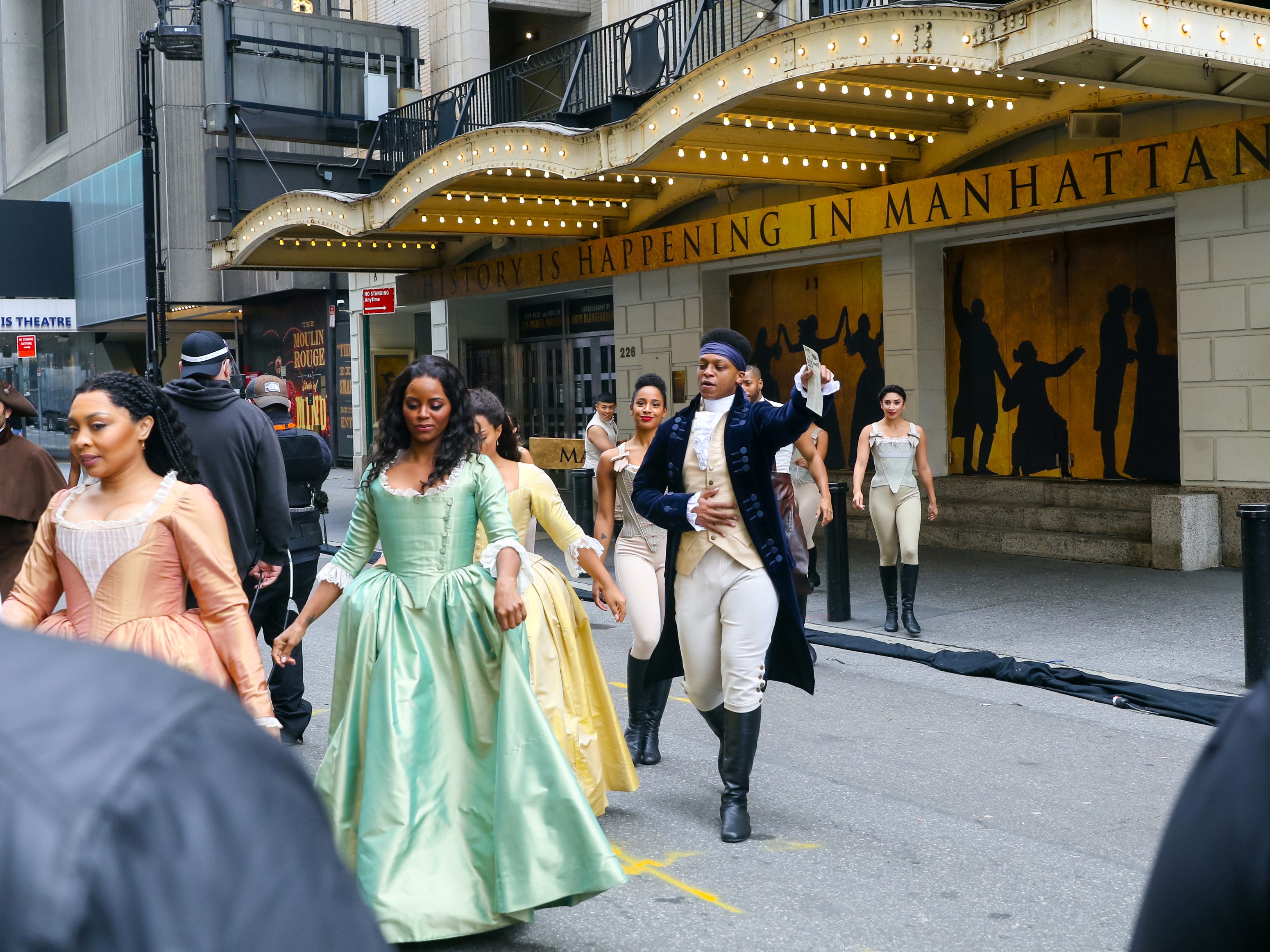The cast of the Broadway show 'Hamilton' pictured pre-taping a show for the Macy's Thanksgiving Day Parade show outside the Richard Rogers Theater in New York City