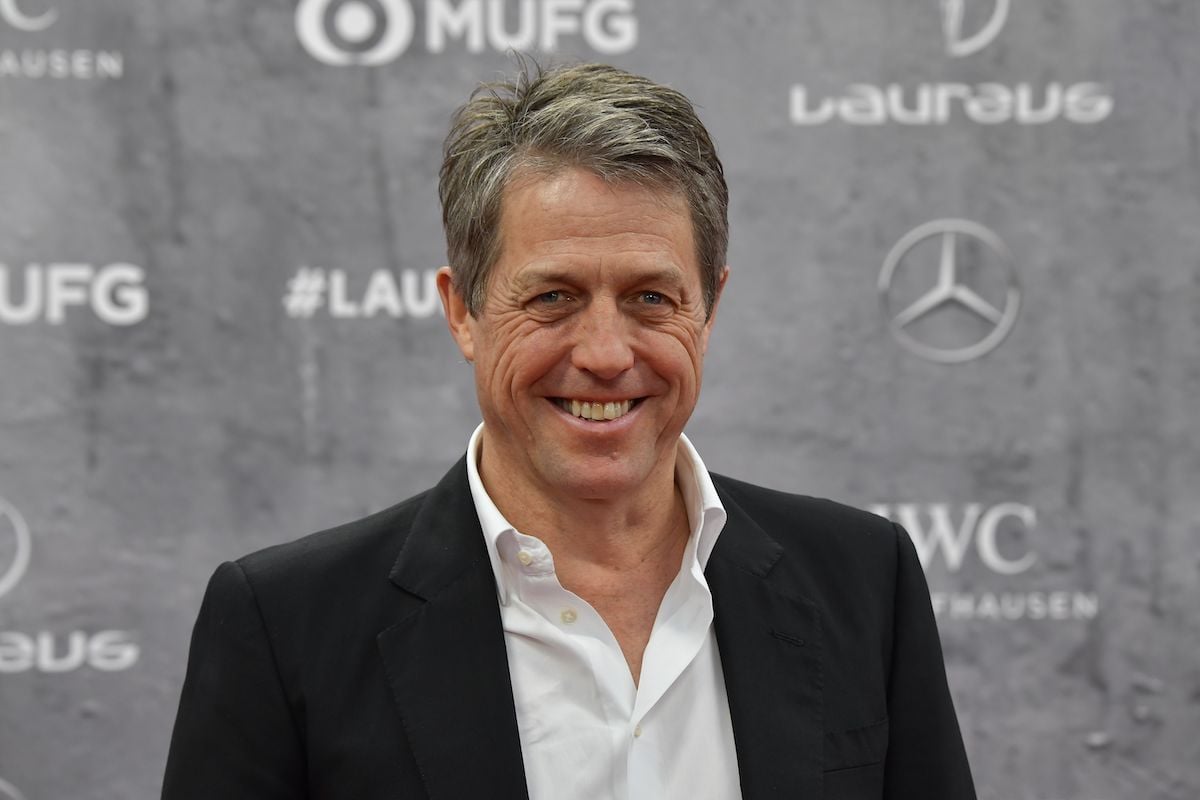 Hugh Grant poses on the red carpet