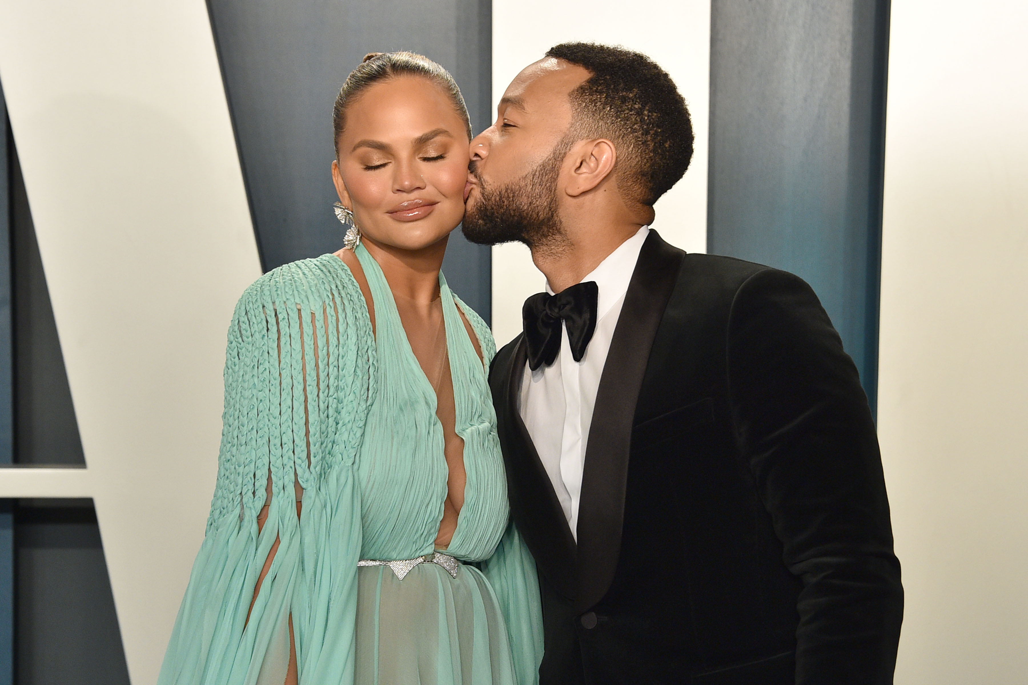 Chrissy Teigen and John Legend attend the 2020 Vanity Fair Oscar Party at Wallis Annenberg Center for the Performing Arts