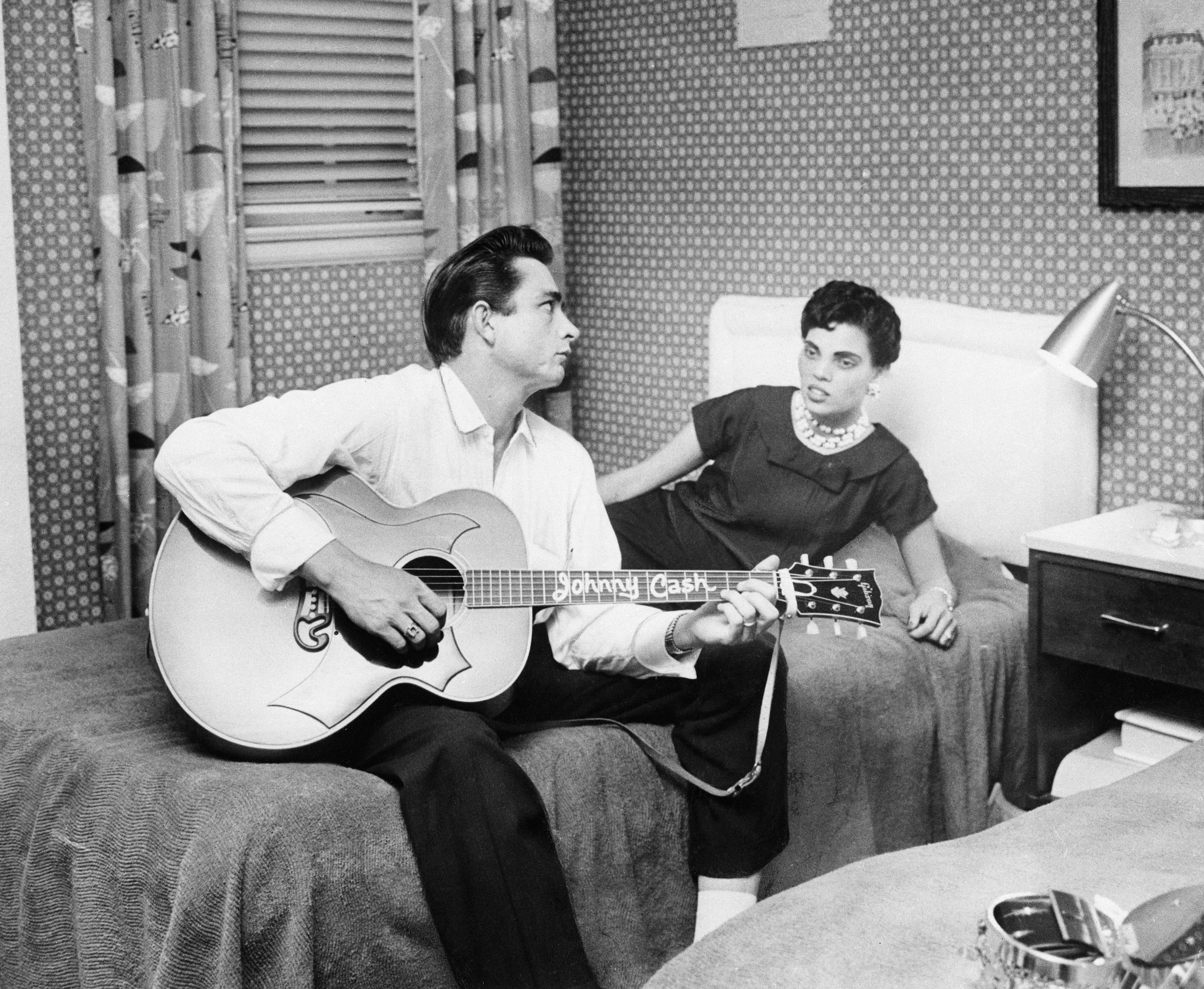 Country musician Johnny Cash rehearses with his wife, Vivian Liberto