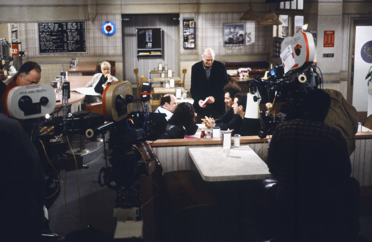 Larry David speaks with the 'Seinfeld' cast during the filming of the series finale