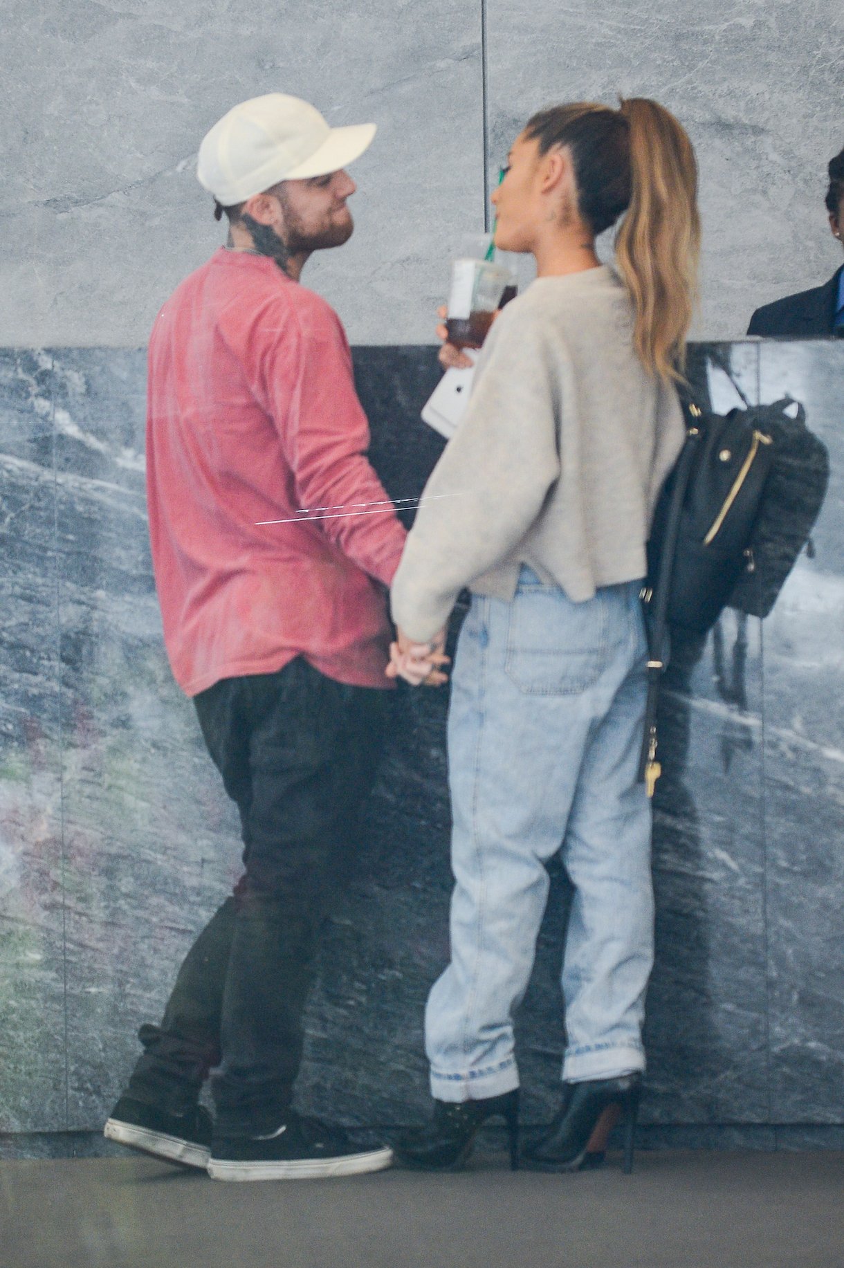 Rapper Mac Miller and singer Ariana Grande enter the Sirius XM Studios on September 20, 2016