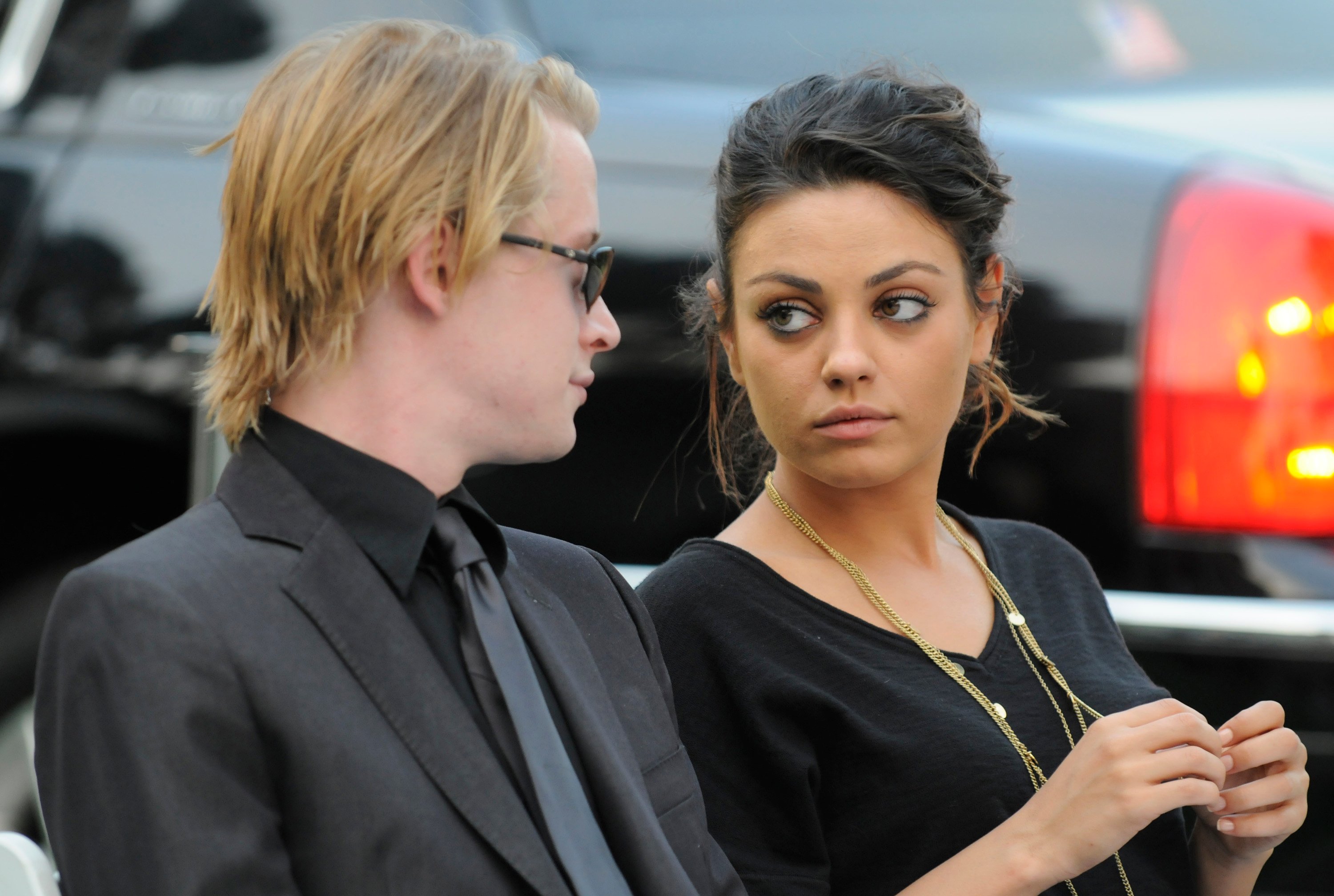 Macaulay Culkin and Mila Kunis attend Michael Jackson's funeral service held at Glendale Forest Lawn Memorial Park on September 3, 2009