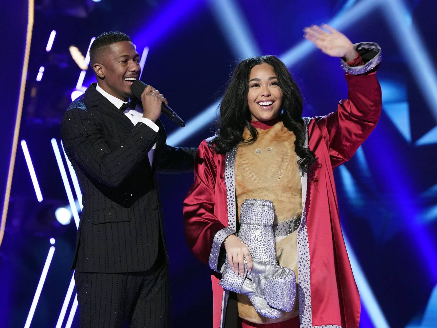 L-R: Host Nick Cannon and Jordyn Woods in the The Mother Of All Final Face Offs, Part 1 episode of THE MASKED SINGER airing Wednesday, April 8 (8:00-9:01 PM ET/PT) on FOX.