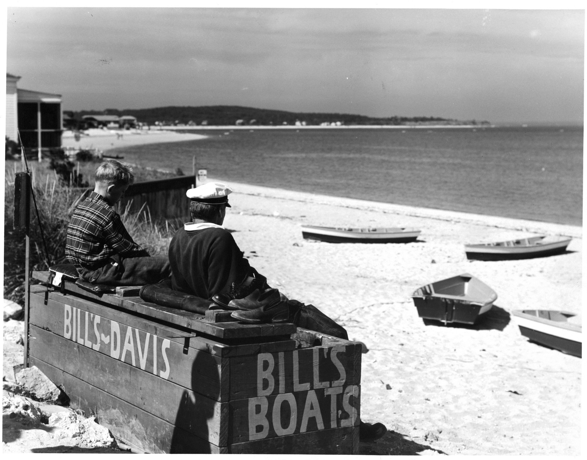 Child and father on the beach in Oyster Bay