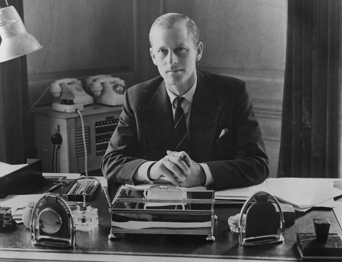 Prince Philip, the Duke of Edinburgh, sitting at his desk at Clarence House in 1951