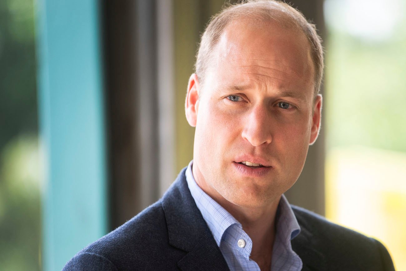 Prince William displaying a solemn express, close up