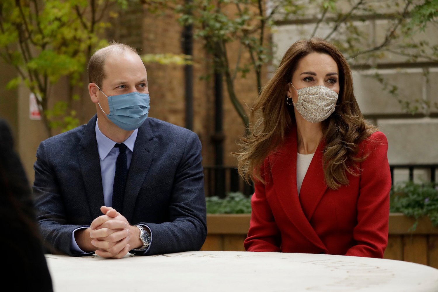 (L-R) Prince William and Kate Middleton, both wearing masks