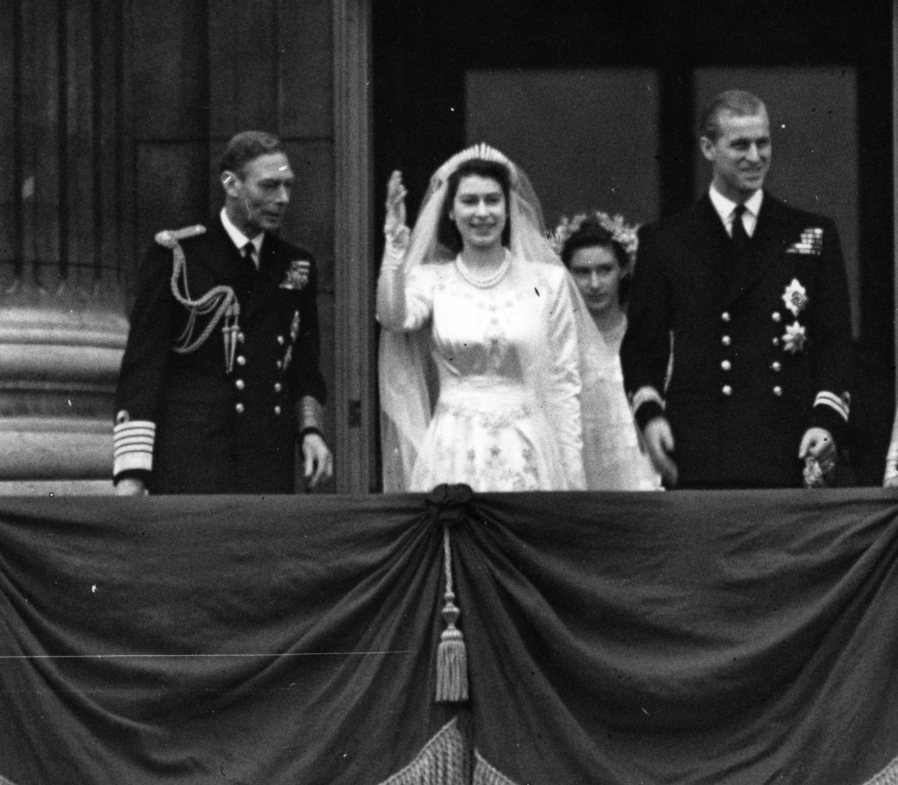 Princess Elizabeth, with Philip, Duke of Edinburgh and King George VI on the balcony of Buckingham Palace after royal wedding