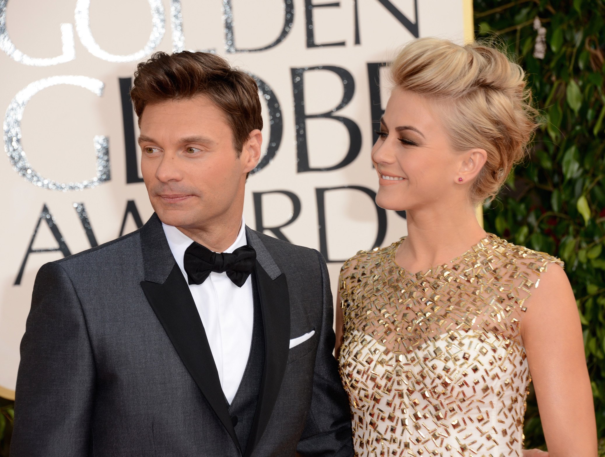 Ryan Seacrest (L) and dancer Julianne Hough arrive at the 70th Annual Golden Globe Awards