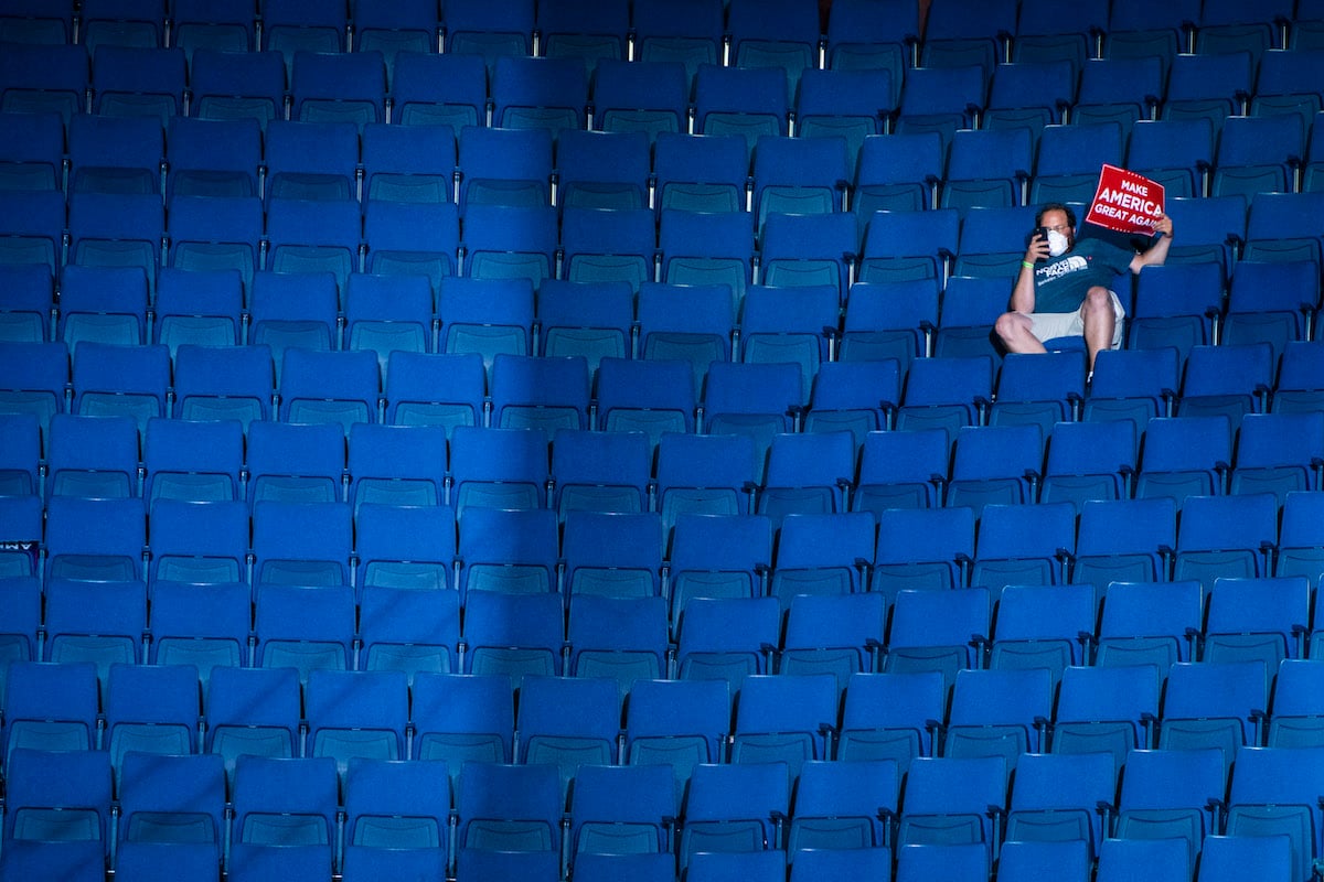 A supporter sitting in the upper section of seating watches as President Donald J. Trump speaks during a "Make America Great Again!" rally at the BOK Center on Saturday, June 20, 2020 in Tulsa, OK