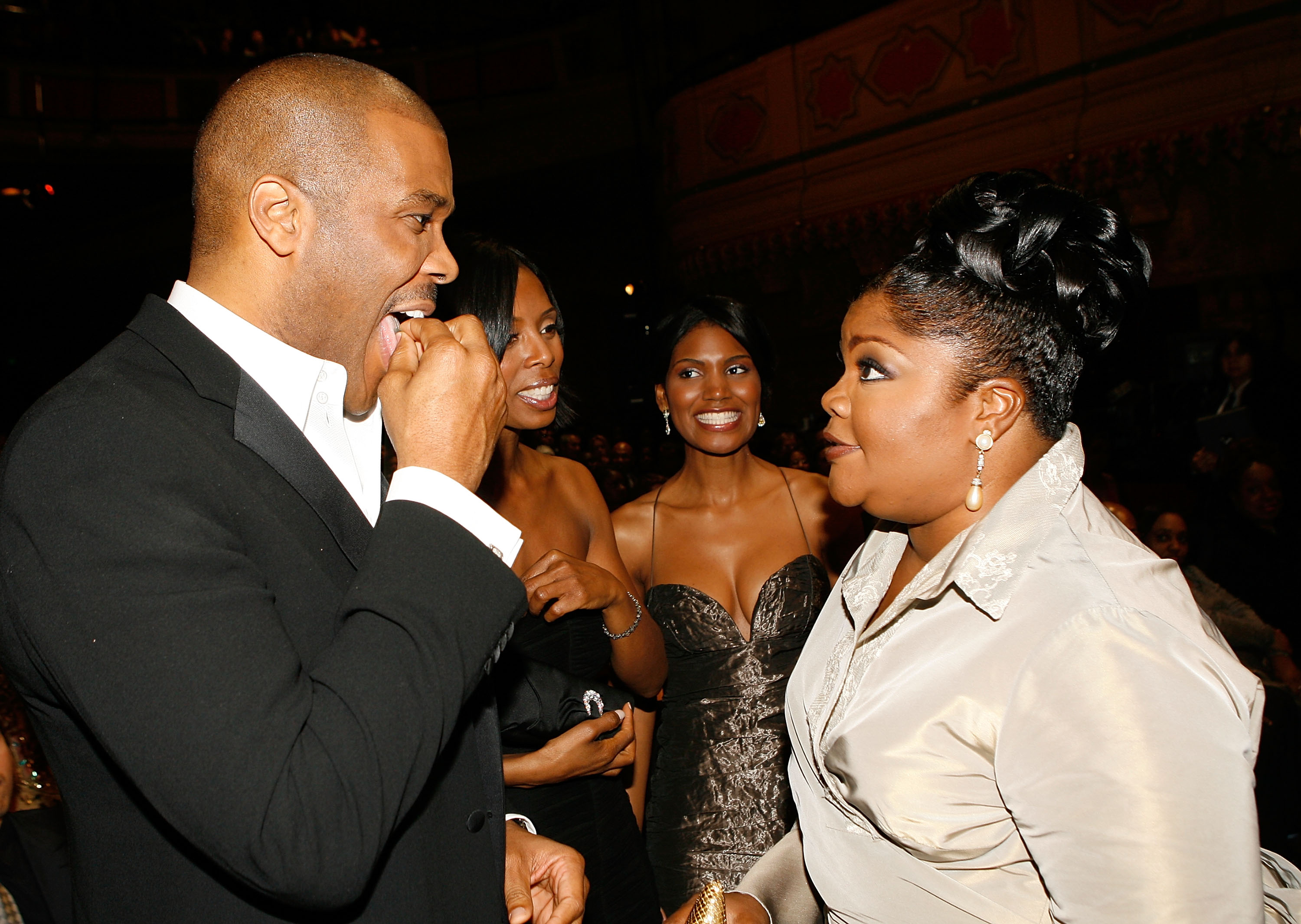 Producer/director/actor Tyler Perry (L) and comedian Mo'Nique talk in the audience during the 38th annual NAACP Image Awards held at the Shrine Auditorium on March 2, 2007 in Los Angeles, California