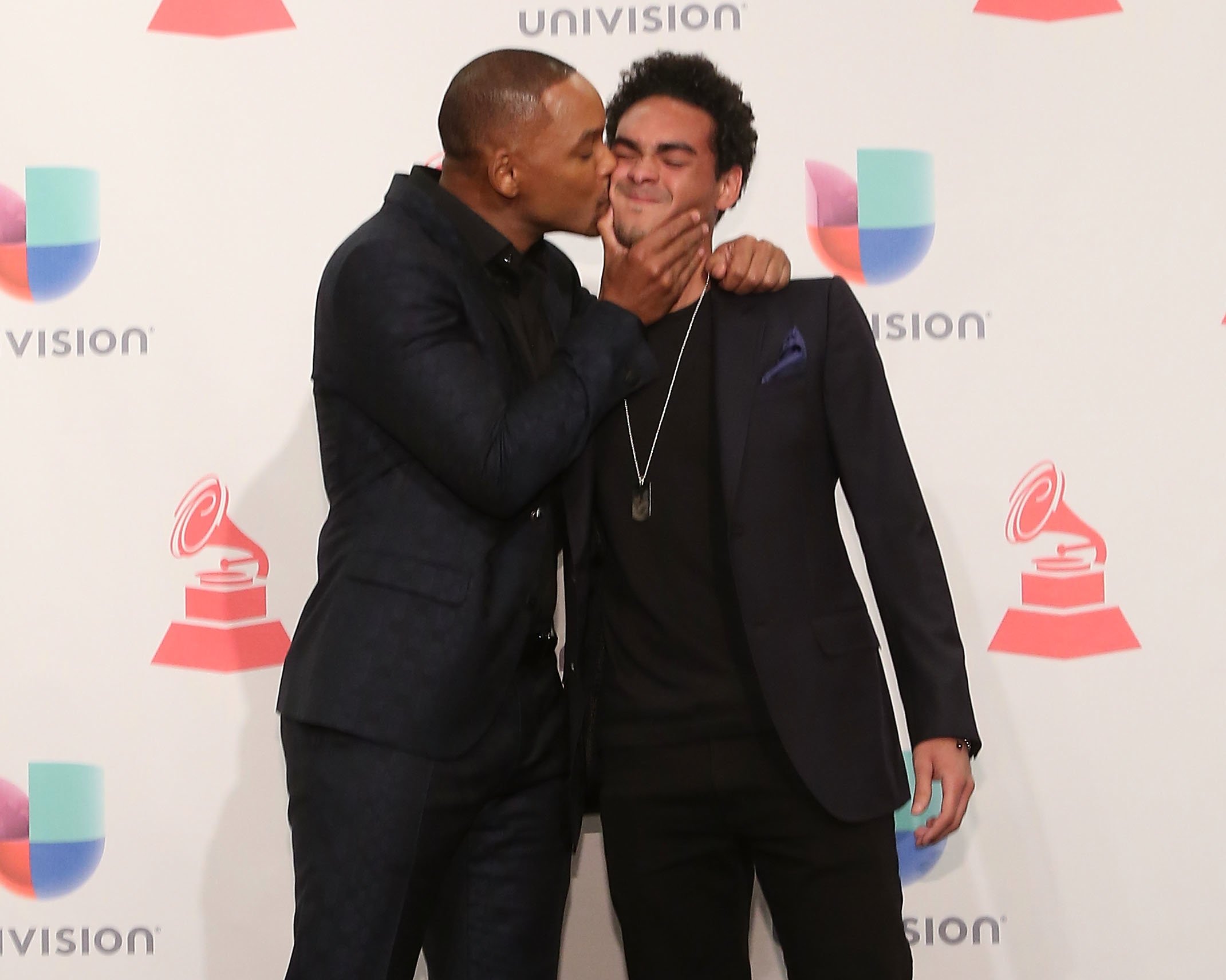 Will Smith and Trey Smith pose in the press room during the 16th Annual Latin GRAMMY Awards