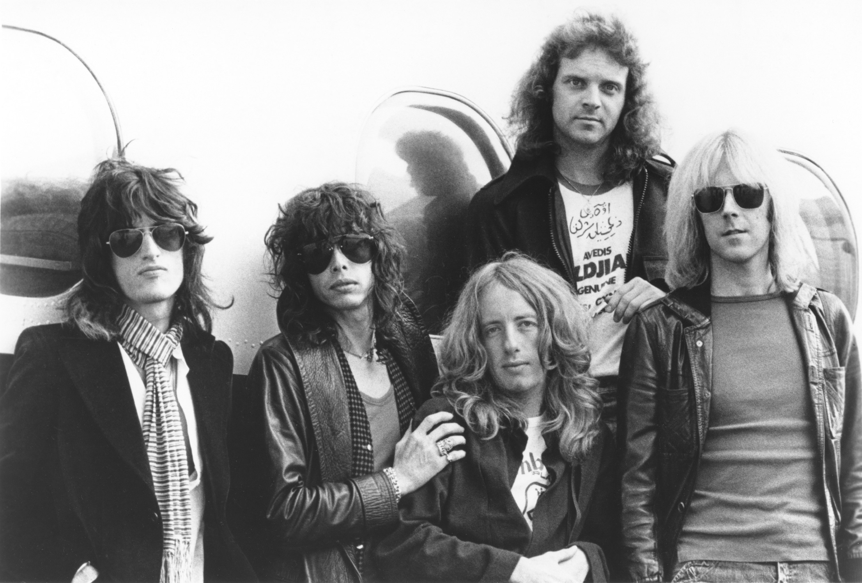 Aerosmith in front of a plane