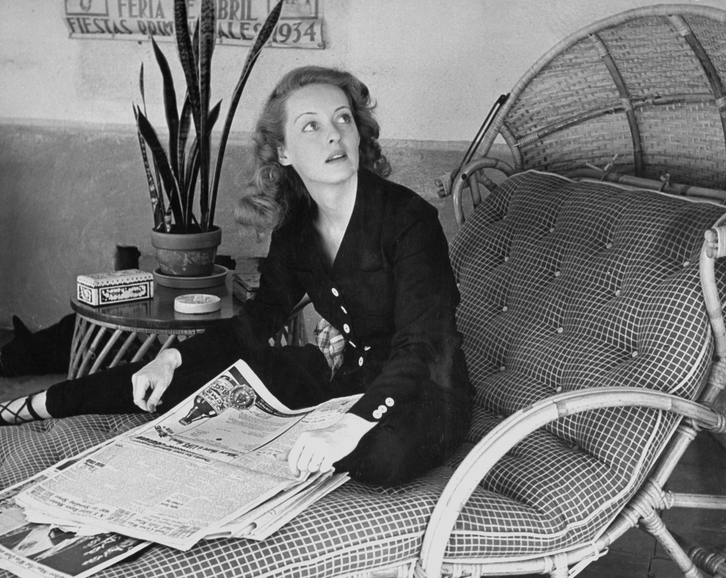 Bette Davis with a newspaper