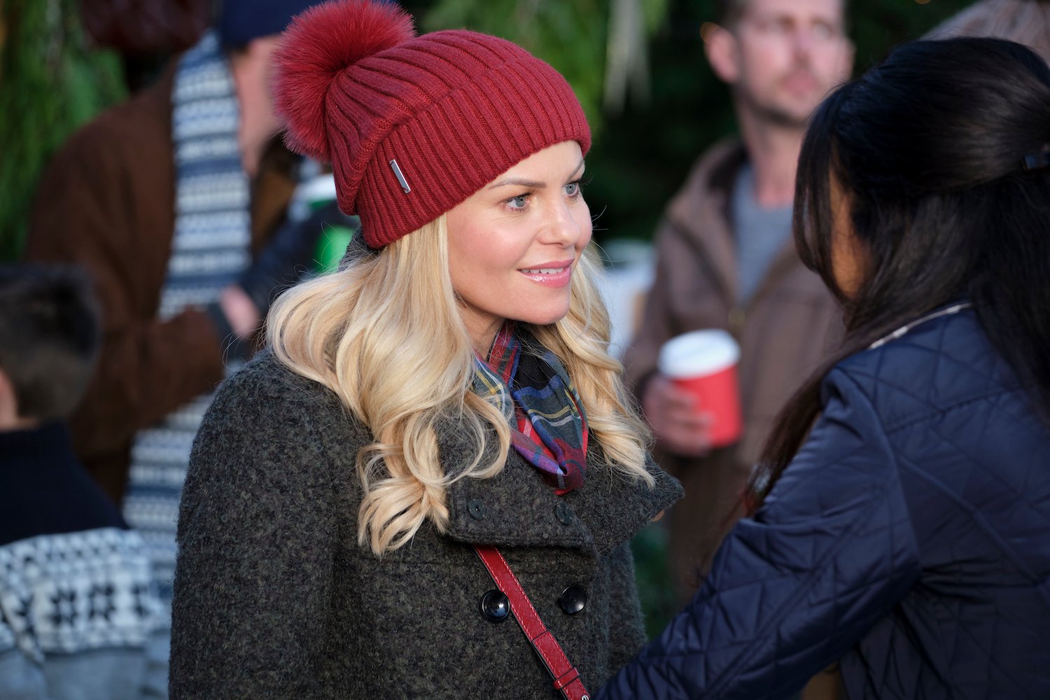 Candace Cameron Bure wearing a red knit hat in 'If I Only Had Christmas'
