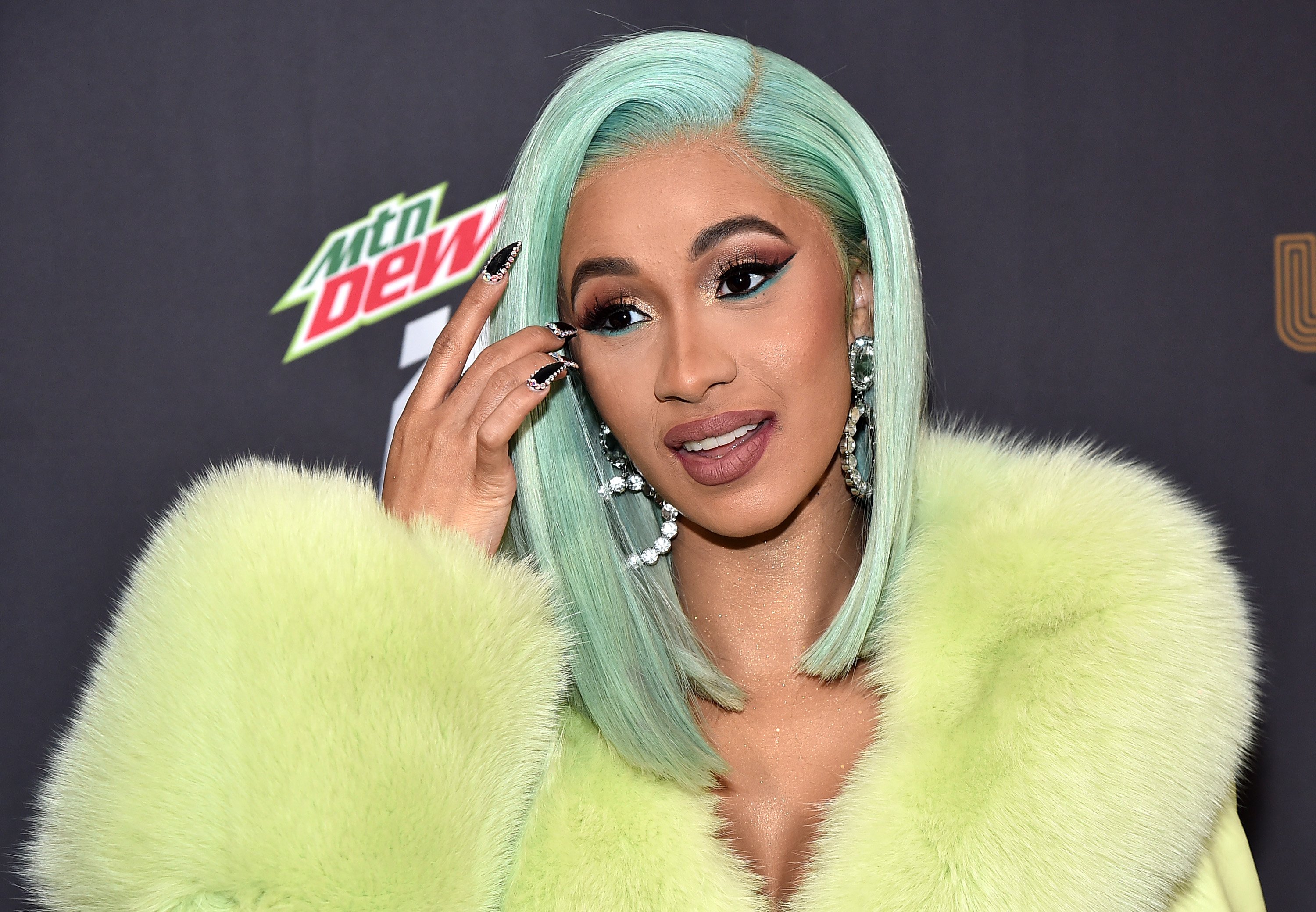 Cardi B wearing green