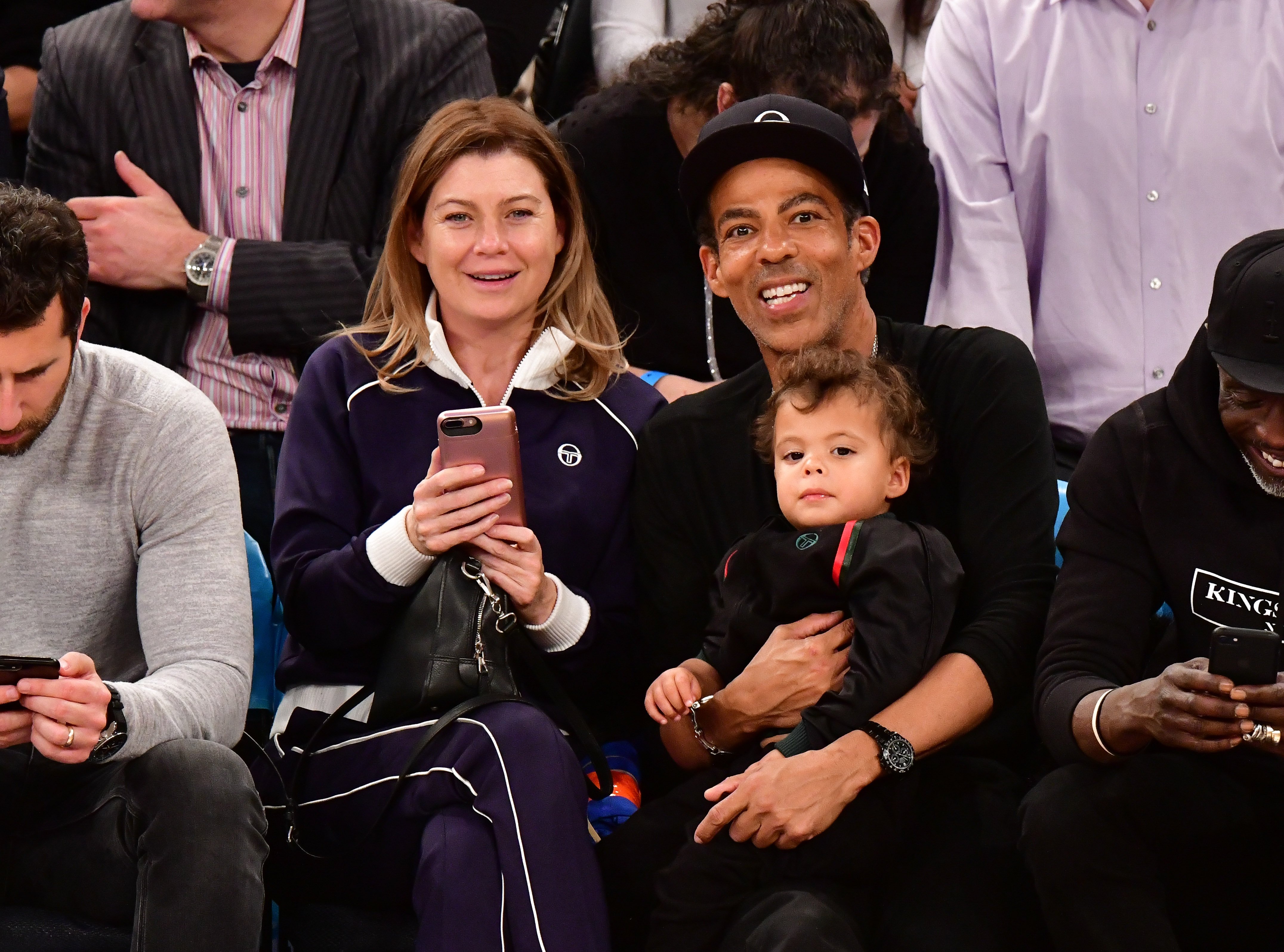 Ellen Pompeo, Eli Ivery, and Chris Ivery attend the Portland Trail Blazers vs New York Knicks game on November 20, 2018 in New York City. 