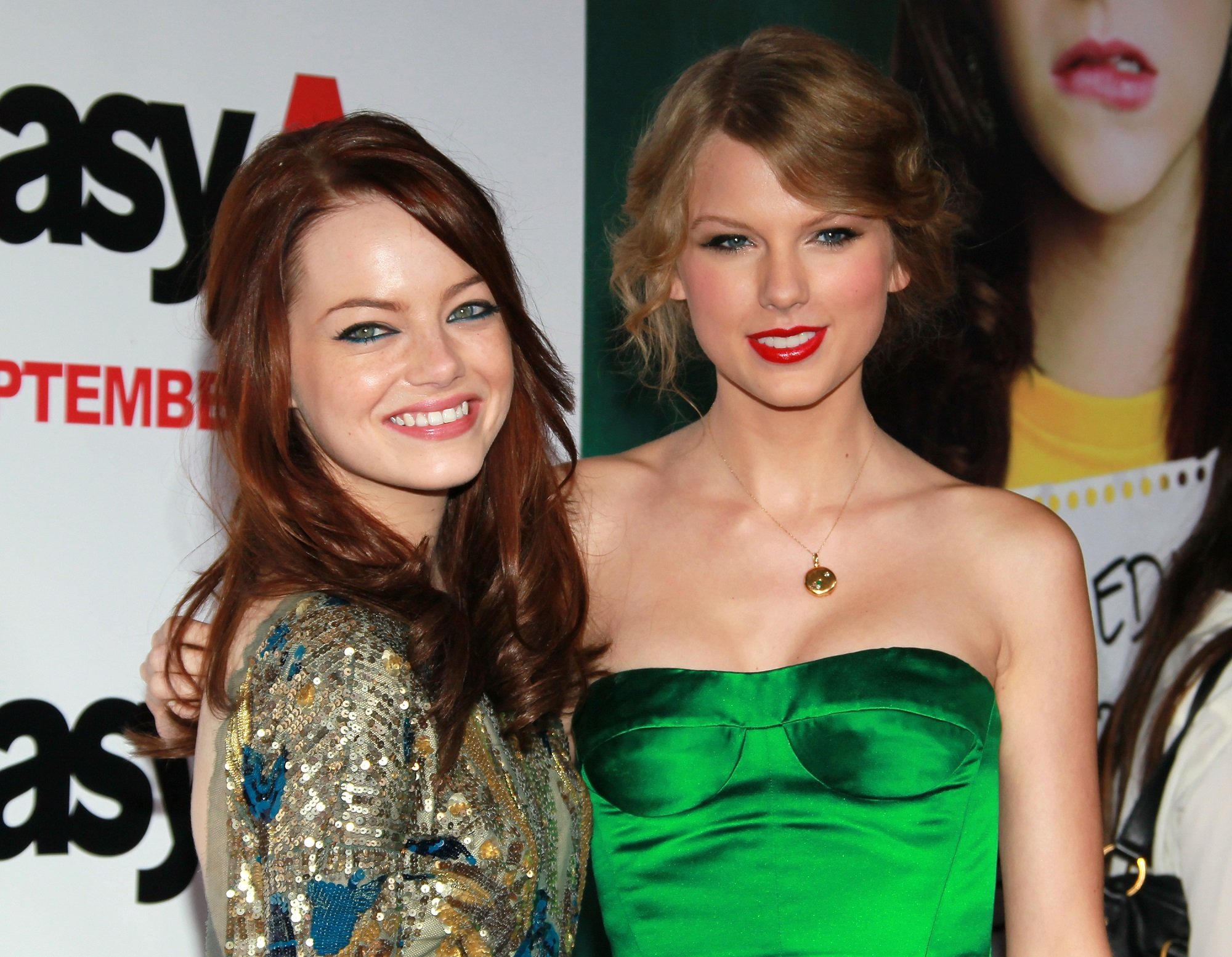 Emma Stone (L) and Taylor Swift attend the premiere of 'Easy A' on September 13, 2010, in Hollywood, California.