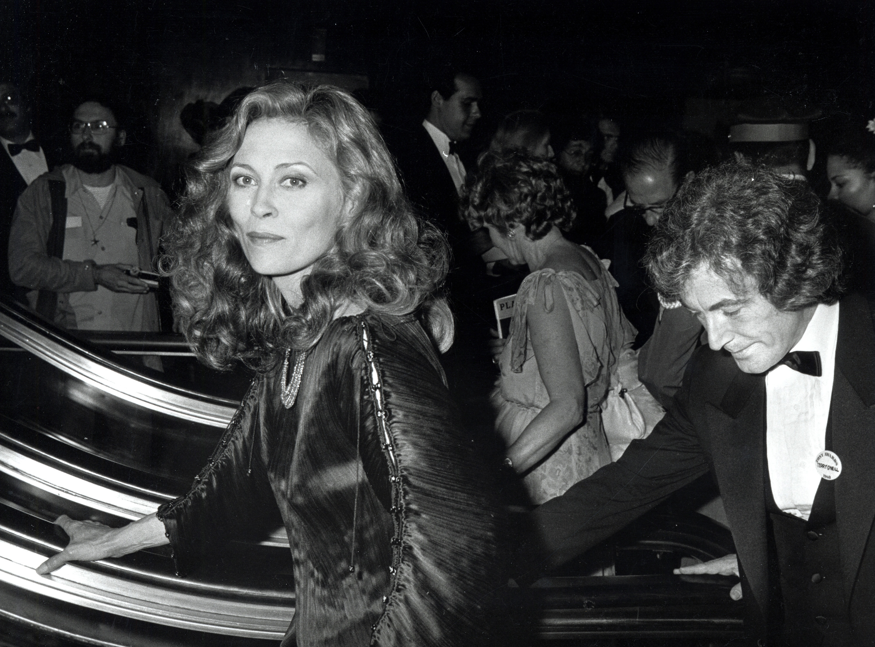 Faye Dunaway on an escalator