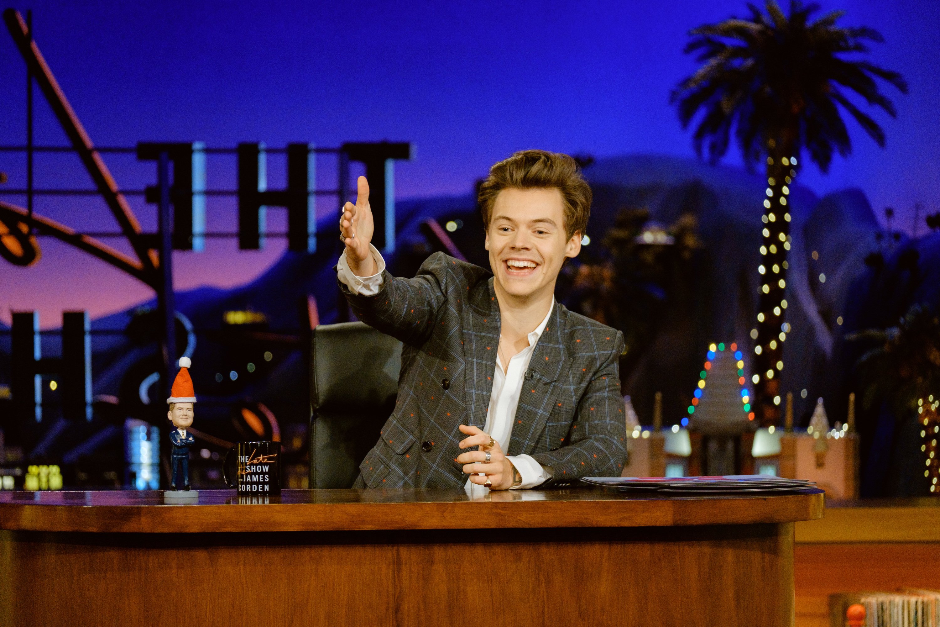 Harry Styles at a desk