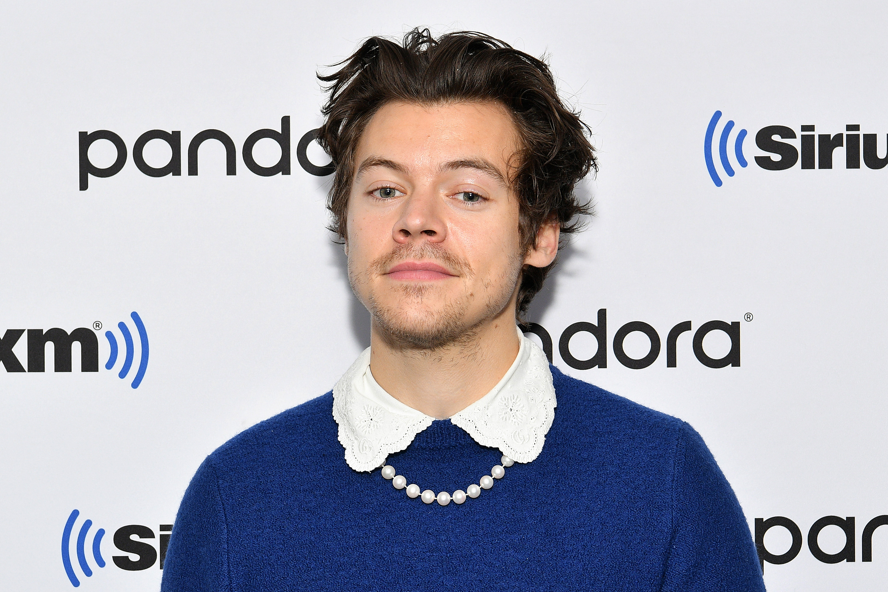 Harry Styles wearing a necklace