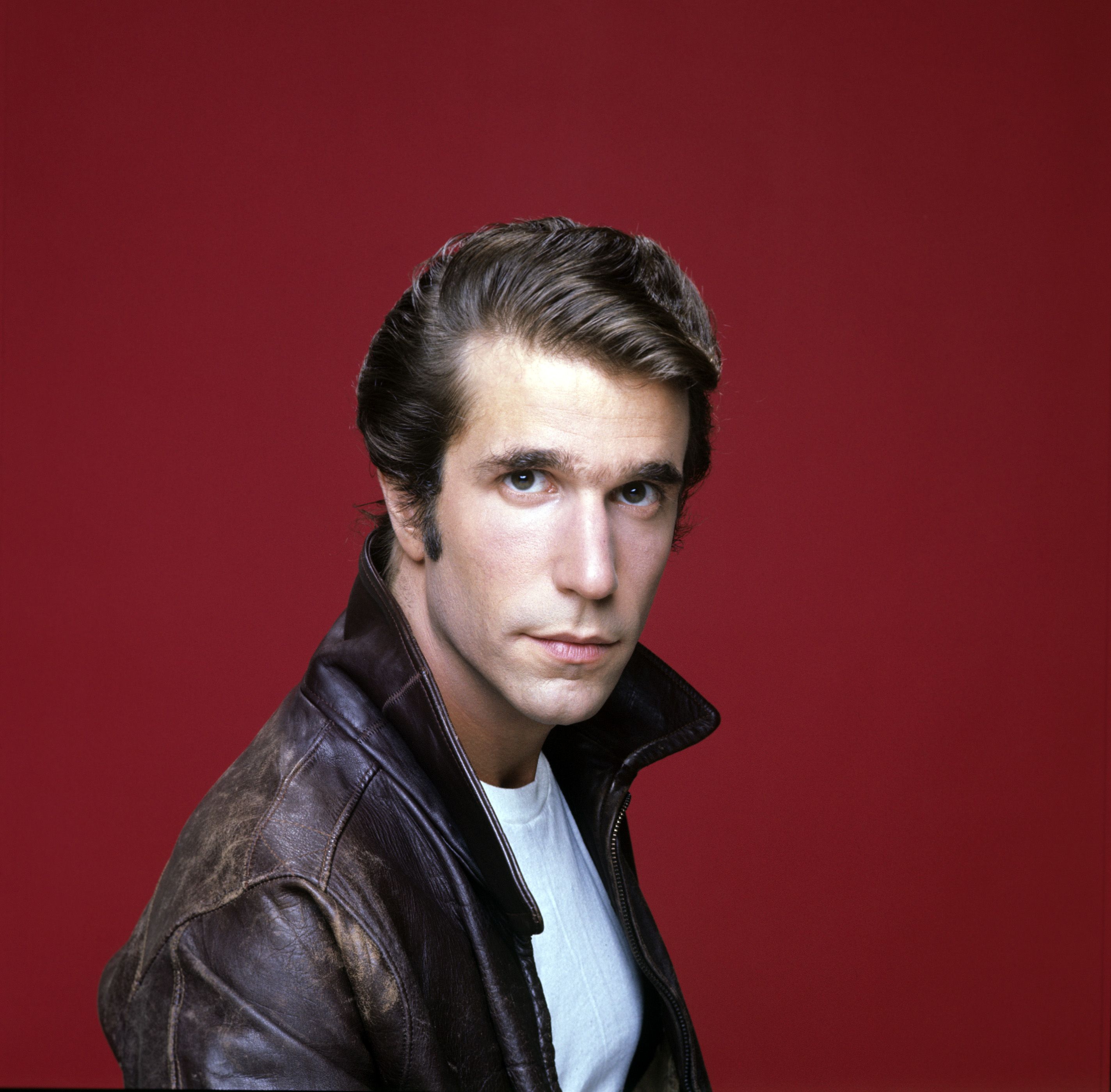 The Fonzie in front of a red background