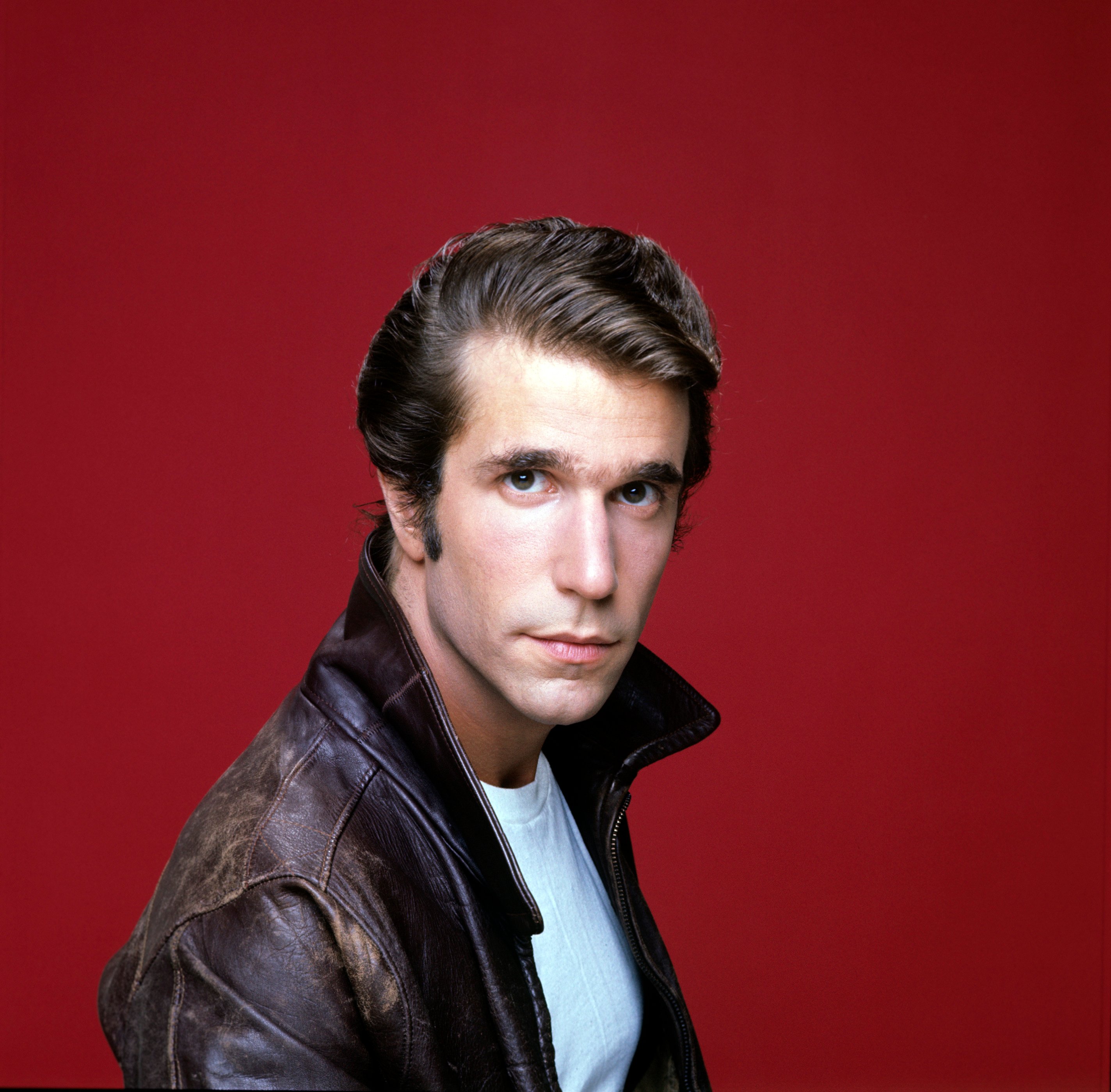 The Fonzie in front of a red background