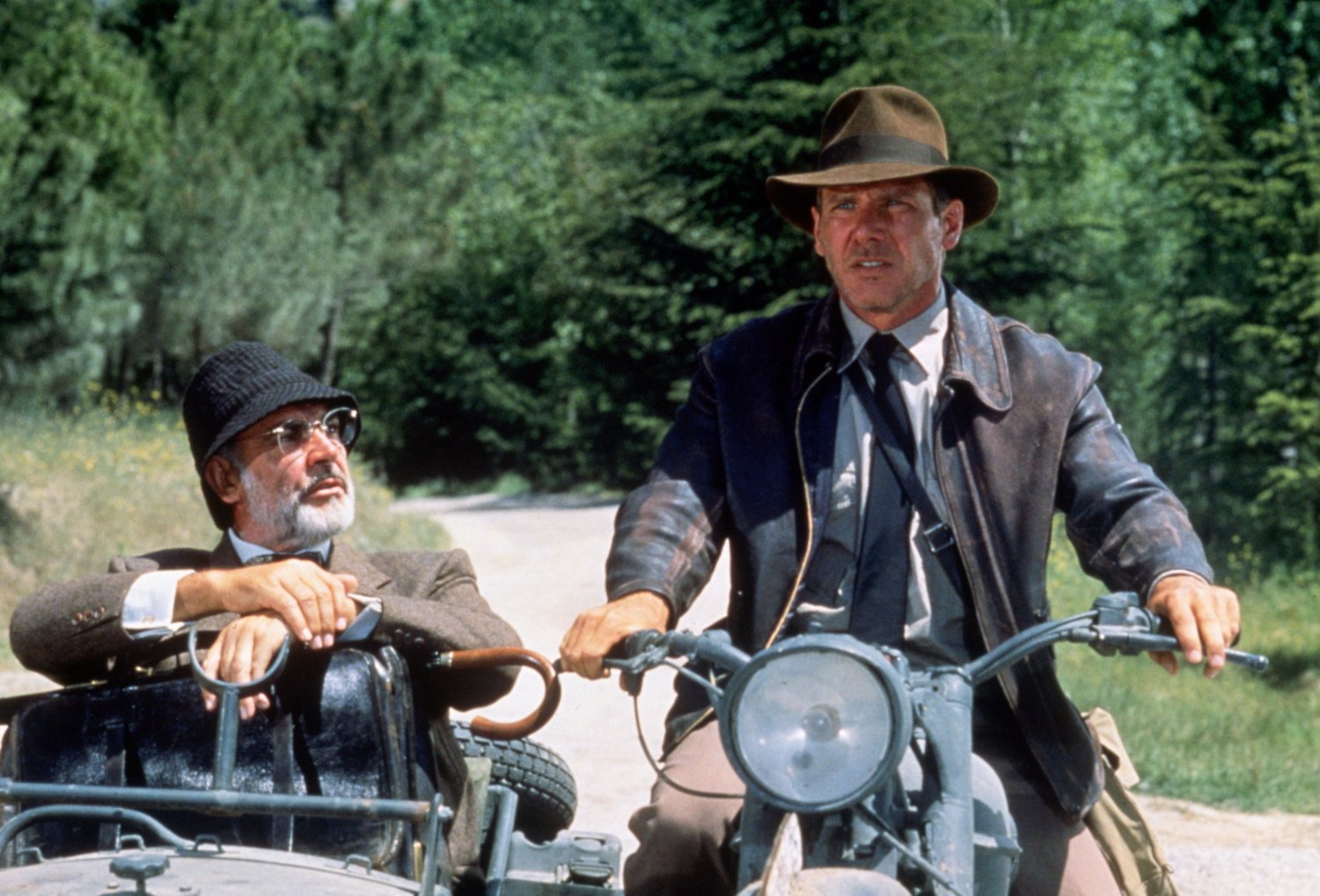 Sean Connery in sidecar and Harrison Ford on a motorcycle